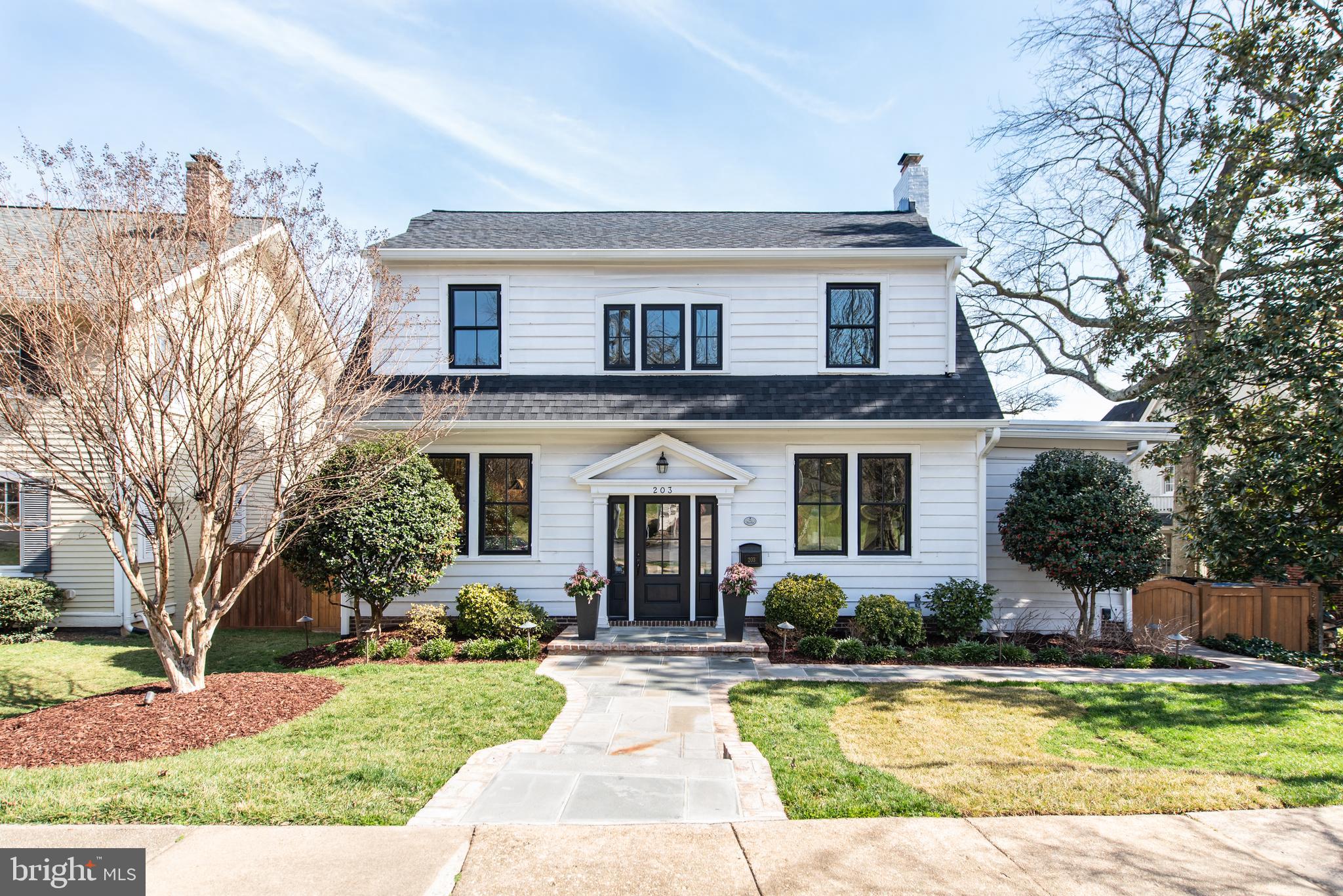 The Brocki Group presents 203 North View Terrace: a home in the heart of Rosemont. You can imagine that with a street name like that, you might expect some spectacular views of the surrounding area. Could it be the quiet comfort from the canopy of trees overhead on this well-established block or the subtle glow from the GW Masonic Memorial. We’ll let you choose. But for this home, it’s the view from within that really sets it apart. Want to see? Follow me. Step down the flagstone walk toward the front door, pause to take note of the exterior palette – the brilliant white accented by ebony tones gives classic modern sophistication. Now inside, welcome to a curated design experience where no detail has been spared. To the left, the expansive reimagined kitchen thoughtfully embodies functionality and style with professional grade appliances, custom cabinetry and solid surface countertops. This space will surely elevate the everyday and wow the crowd for gatherings. But there is more, float through the sunkissed foyer over to the family room where a delicately trimmed accent wall with (fully operational) wood burning fireplace isn’t the only feature. Tucked behind the floral accent wall is a custom designed study enclave with cleverly concealed built-in storage and warm metal accents throughout. Now, back to the foyer to experience the dwelling quarters. The sun filled second level features a newly renovated and uniquely designed guest bath and two adjacent bedrooms. But it’s the primary suite that shines. In this professionally redesigned bathroom, the warm marble tones, custom cabinetry and metal accents complement the warmth radiating from the heated floors. The tour is not over yet. Head back to the kitchen to discover a hidden gem. Newly renovated in its entirety, the basement features another living room and flex space perfect for a fitness zone, an additional full bath and laundry room and well-appointed bedroom with access to the outdoor flagstone patio. Now outside, choose your spot – will you relax on the tiered Trex terrace with outdoor TV or play in the yard amongst the glow coming from the lights nestled within the manicured landscaping. Either way, you have a 6,540 square foot lot to make your own. If that is not enough, you’re a stone's throw away from all of the charm and convenience of Old Town Alexandria. Walk or bike to the King Street Metro, Amtrak station, Carlyle District, Whole Foods, parks and playgrounds, boutique shops, local parades, GW Masonic Memorial, the highly sought-after Brooks Elementary and more. The word ‘curated’ denotes thoughtfully chosen and well presented. And that it is. At every turn, this classic home has been newly reimagined from its exterior to its interior – all 2,800 square feet of it. Here is a list of upgrades you can expect: new windows, roof, siding, lush landscaping, hardscaping with exterior lighting system, Trex decking, flagstone patios and lead walks. Newly renovated kitchen and 3.5 baths, new fixtures and finishes throughout, new hardwood floors and trim, 2 zone HVAC and split system in basement and ample attic storage. So, since we’ve already done the curating, all that is left is to experience it yourself!