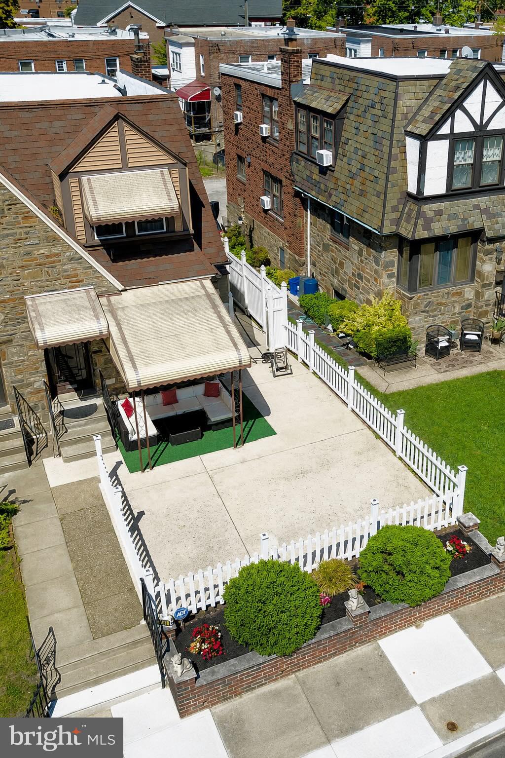 **Welcome to 1103 Kenwyn Street – A Beautifully Maintained Northwood Twin!**

Pride of ownership shines throughout this spacious and well-maintained twin home located in the desirable Northwood section of Philadelphia. The heart of the home is the updated kitchen, featuring granite countertops, a breakfast bar, ample cabinet space, and direct access to a covered rear deck—perfect for morning coffee or evening relaxation.

Step outside and enjoy peaceful views overlooking an open park where neighborhood games and community activities are frequently held. Just off the deck, you'll find one of this home's unique features: a convenient rear staircase providing secondary access to the second floor.

Upstairs offers three generously sized bedrooms and an updated hall bathroom complete with a rain showerhead and sliding glass doors. The primary bedroom features its own private en-suite bathroom with a stand-up shower, providing comfort and convenience.

The main level also boasts a cozy wood-burning fireplace, creating the perfect gathering space during cooler months.

The finished lower level offers even more living and entertaining space, featuring a wet bar, half bath, laundry room, and a versatile bonus room ideal for a home office, gym, playroom, or guest space. Double doors lead directly from the basement to the covered patio area beneath the deck, the two-car private driveway, and additional storage sheds.

Conveniently located near parks, shopping, public transportation, and major roadways, this move-in-ready home combines charm, functionality, and exceptional outdoor living. Schedule your private showing today and discover everything 1103 Kenwyn Street has to offer!