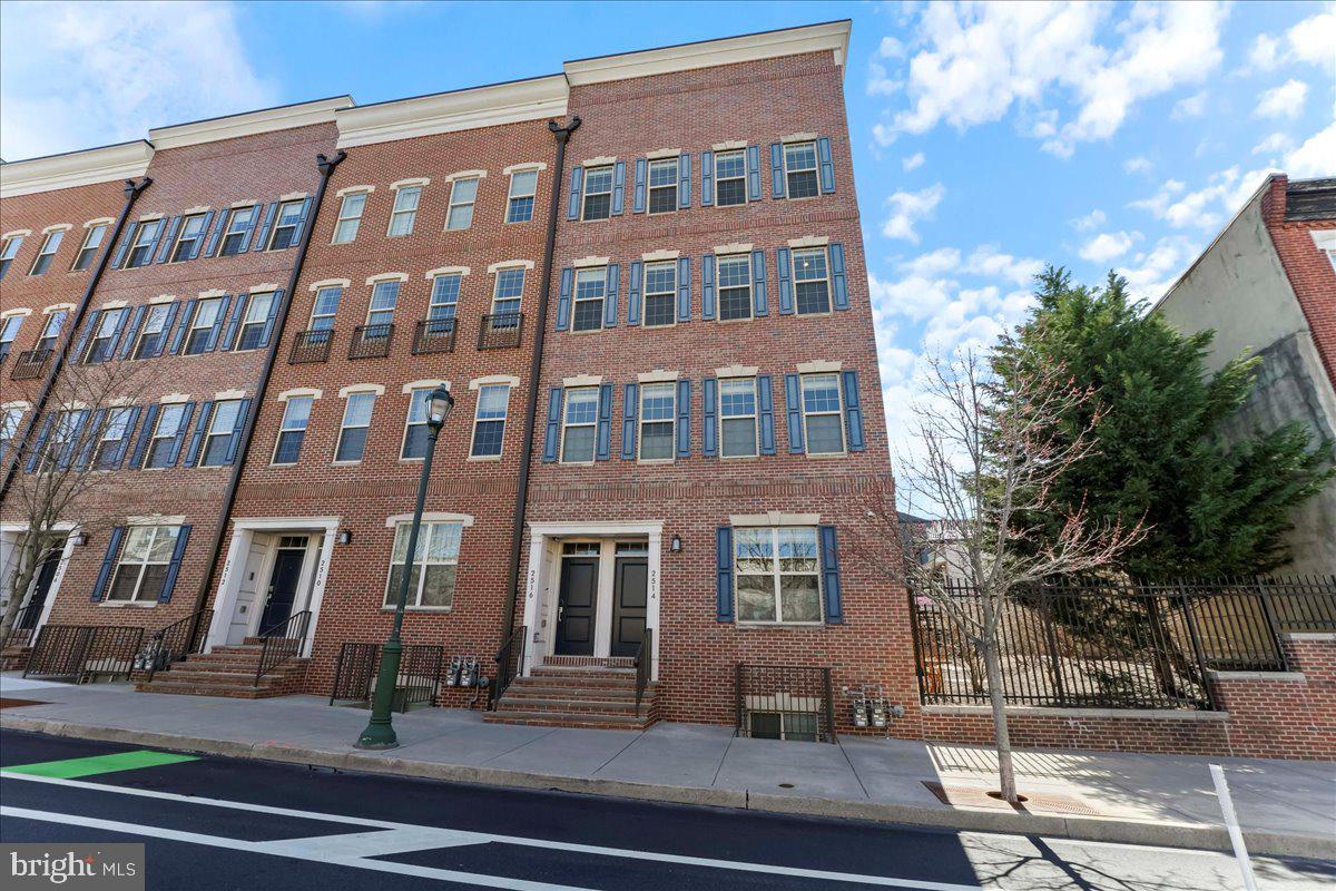 Don’t miss this move-in ready real estate unicorn — a rarely available, newly renovated three-bedroom, two-and-a-half-bathroom upstairs end-unit townhouse with 1 CAR GARAGE in Center City and that is ranked 93/100 (a Walker's Paradise)!!!   Fall in love with sun-drenched interiors, three magnificent private outdoor spaces, dramatic skyline views, and garage parking in a gorgeous gated community where Graduate Hospital, Fitler Square and University City meet.
Inside this better-than-new, 2,400-square-foot residence, 9-foot-tall ceilings with new recessed lighting rise above fresh paint, gleaming hardwood floors and updated carpeting. Large windows on the northern, western and southern exposures flood the home with natural light, while custom window treatments create the ideal ambiance. Enjoy an expansive open layout perfect for relaxing and entertaining, starting with an inviting living and dining area flanked by a powder room. Ahead, the meticulously updated and reimagined gourmet kitchen opens to a spacious family room. Warm yourself in front of the stunning stacked-stone fireplace flanked by built-ins finished with designer-sourced painted accents and cabinet pulls. Chefs will adore the beautifully planned kitchen’s white soft-close maple cabinetry, new quartz counters, and all-new GE Profile stainless steel appliances, including a four-burner gas range with a griddle, French Door refrigerator, dishwasher and wine refrigerator. Take casual meals in the sun-kissed breakfast nook or wide island/breakfast bar, or step out to the south-facing balcony for morning coffee or after-dinner drinks. Sleep soundly in the renovated upper-level primary suite featuring a king-size layout, dramatic tray ceiling, private balcony, and two custom walk-in closets. The en suite spa bathroom impresses with a deep soaking tub, shower and marble-topped double vanity surrounded by gray natural stone flooring. Two spacious and bright secondary bedrooms share a well-appointed hall bathroom, while an oversized laundry room with a side-by-side washer-dryer makes laundry day a breeze. This home’s crowning glory is the incredible 530-square-foot rooftop deck with 360-degree views of the Philadelphia skyline and Fourth of July fireworks. An attached one-car with EV charging completes this turnkey Center City sanctuary.  Brought to you by Toll Brothers, 2400 South is beautifully landscaped community featuring a gated entry and fitness center. From this spectacular Center City location at the border of Fitler Square and Graduate Hospital, you’ll enjoy easy access to prized shopping, dining and cultural venues. Family Friendly / Gated Community and a WALK TO LOCATION -- a quick 15 minute walk over the South Street Bridge  to UNIVERSITY OF PENNSYLVANIA, DREXEL UNIVERSITY, CHOP, Rittenhouse Square and the AMAZING Schuylkill River Trail & Park  + Easy access to highways, buses and trains round out this exceptional location.  DO NOT WAIT!!!
