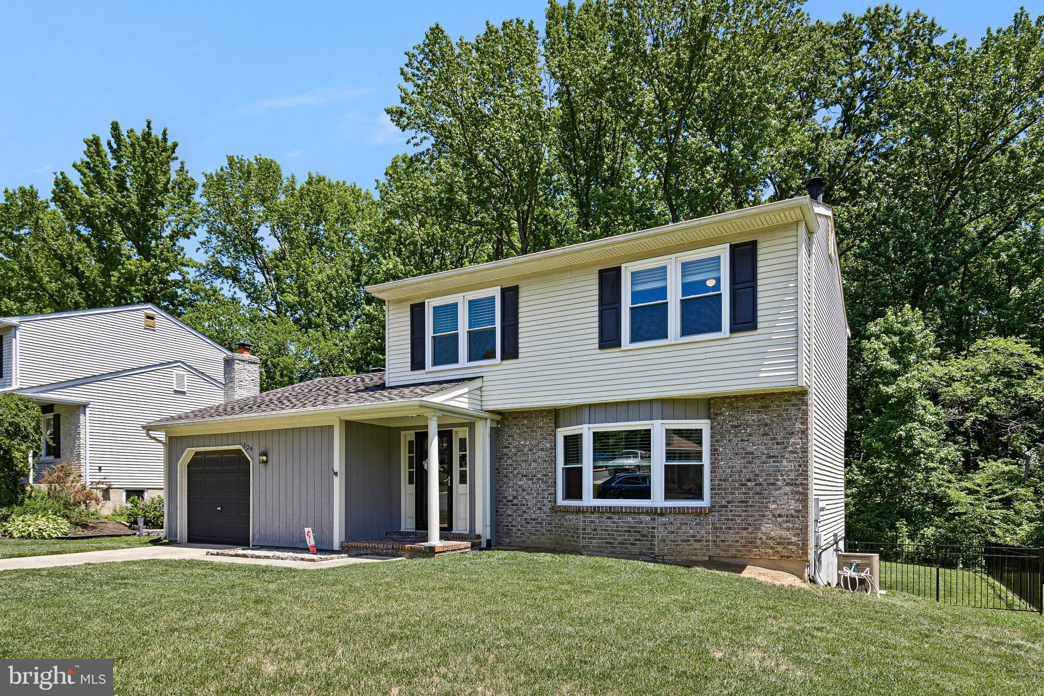Welcome to 129 Pawnee Court, a beautifully updated two-story Colonial tucked onto a quiet cul-de-sac in the sought-after Woods community of Newark, Delaware. Renovated throughout and meticulously maintained, this move-in-ready home blends timeless design with modern, low-maintenance updates, including newer windows backed by a lifetime guarantee, a newer water heater, and a comprehensive French-drain and sump-pump system for genuine peace of mind. Warm wood flooring runs across a sun-filled main level, where a charming bow window floods the living room with natural light and flows effortlessly into the dining area and the heart of the home: a stylishly updated kitchen showcasing granite countertops, a classic subway-tile backsplash, stainless steel appliances, recessed lighting, an undermount sink with gooseneck faucet, and a breakfast bar made for casual mornings and easy entertaining. Just beyond, the inviting family room offers a cozy wood-burning fireplace, a ceiling fan, and direct access to the rear deck, creating an effortless indoor-outdoor connection. A convenient main-level laundry room and powder room sit just off the one-car garage entry, adding everyday ease and smart storage. Upstairs, a private primary suite with its own en-suite bath and walk-in closet provides a restful retreat, while two additional generously sized bedrooms with ample closet space. Step outside to a fully fenced backyard that backs to serene woods, an exceptional blend of privacy and natural beauty, complete with a deck, an added patio, and upgraded yard drainage ideal for relaxing, gardening, or hosting beneath the trees. Washer, dryer, and refrigerator are all included for a seamless, hassle-free transition. Beyond the home itself, the setting is hard to beat: less than a mile from I-95, Route 1, and Route 40, with quick reach to Christiana Hospital, Christiana Mall, the University of Delaware, and an abundance of shopping, dining, and parks. Whether commuting across the region or relocating from out of state, you will love being minutes from everything while enjoying the calm of a tree-lined cul-de-sac. Move-in ready, thoughtfully upgraded, and ideally positioned in one of Newark's most convenient and connected neighborhoods, 129 Pawnee Court is exactly the kind of updated single-family home near I-95 and Route 1 that today's buyers are searching for in Newark, DE 19702. Schedule your private tour today and experience everything this exceptional Newark home has to offer before it is gone.