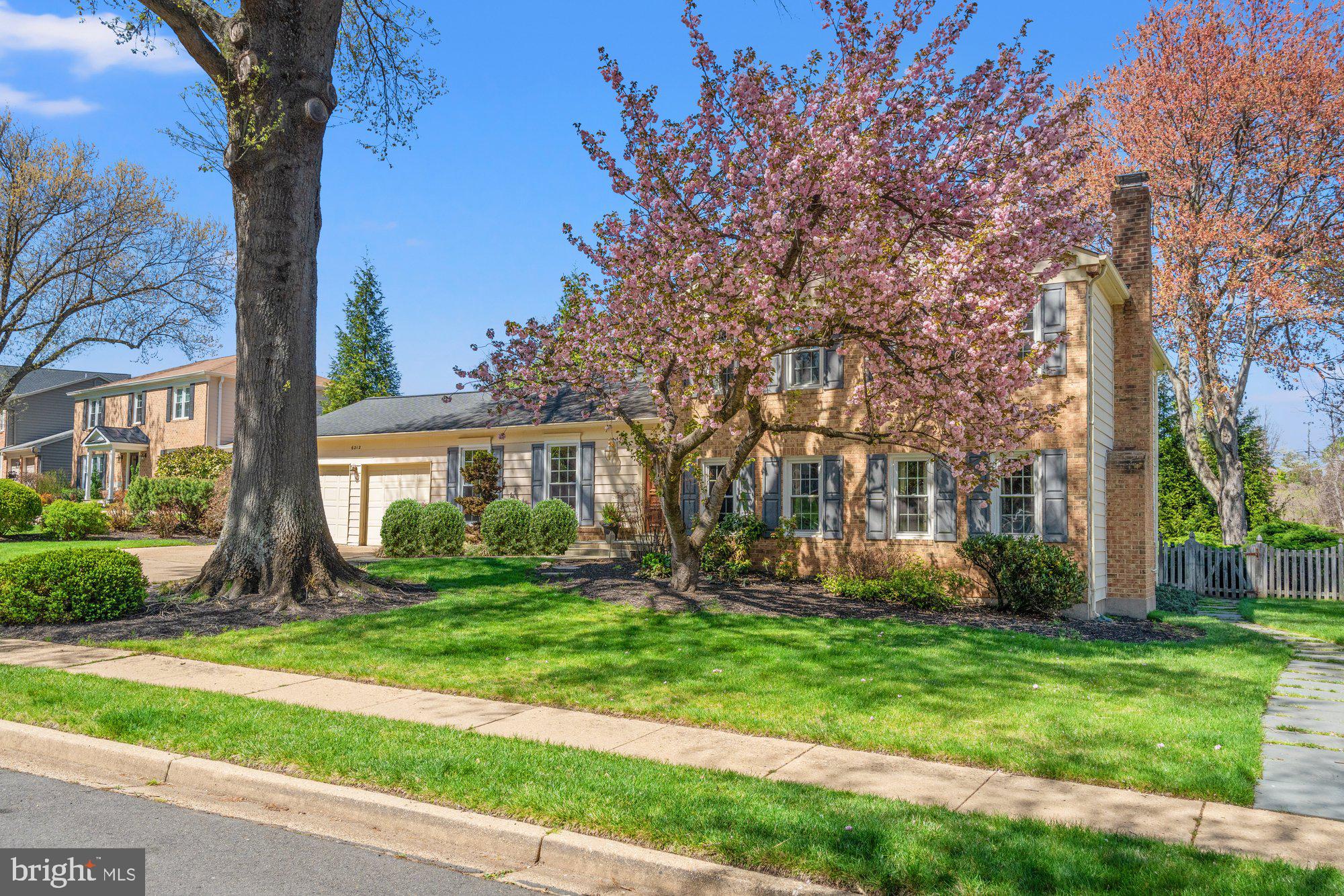 Nestled on a quiet cul-de-sac in sought-after Chesterford, this one-owner home sits on a beautifully matured, tree-lined lot in a neighborhood that feels like a step back in time — sidewalks, mature trees, friendly streets, and a genuine sense of community that newer developments simply don't replicate.
Thoughtfully updated and freshly painted throughout, this move-in ready home is a comfortable place to live today with plenty of room to make it your own over time. Newer windows, a kitchen and baths that have been meaningfully refreshed, and consistent care throughout speak to a home that's been genuinely loved.
The welcoming foyer opens to a light-filled main level showcasing hardwood floors, soaring cathedral ceilings, and a wall of windows framing the private backyard. Living and dining rooms flow seamlessly to a screened porch — ideal for entertaining or simply unwinding — while the spacious eat-in kitchen impresses with custom cherry cabinetry, granite countertops, stainless appliances, a double pantry, and direct access to the two-car garage.
Upstairs, two secondary bedrooms and an updated hall bath complement a generous primary suite featuring a walk-in closet ready to personalize, a private bath with double sinks and jetted tub, and a flexible sitting room that could easily serve as a fourth bedroom.
Just a few steps down from the main level, a true gathering space awaits: hardwood floors, walls of windows, and a handsome gas fireplace set against a stone accent wall, framed by custom cherry built-ins is a true gathering space.  A powder room, large laundry room with backyard access, and a versatile office/library/flex room — easily a fifth bedroom — round out this level.
The deepest level delivers even more: an oversized recreation room, additional office, bonus room or home gym, full bath, utility room, and abundant storage throughout.
Deceptively spacious at over 4,000 square feet, this home offers generous room sizes and a remarkably flexible floor plan — all within close proximity to Chesterbrook Shopping Center, parks, and top-rated schools.