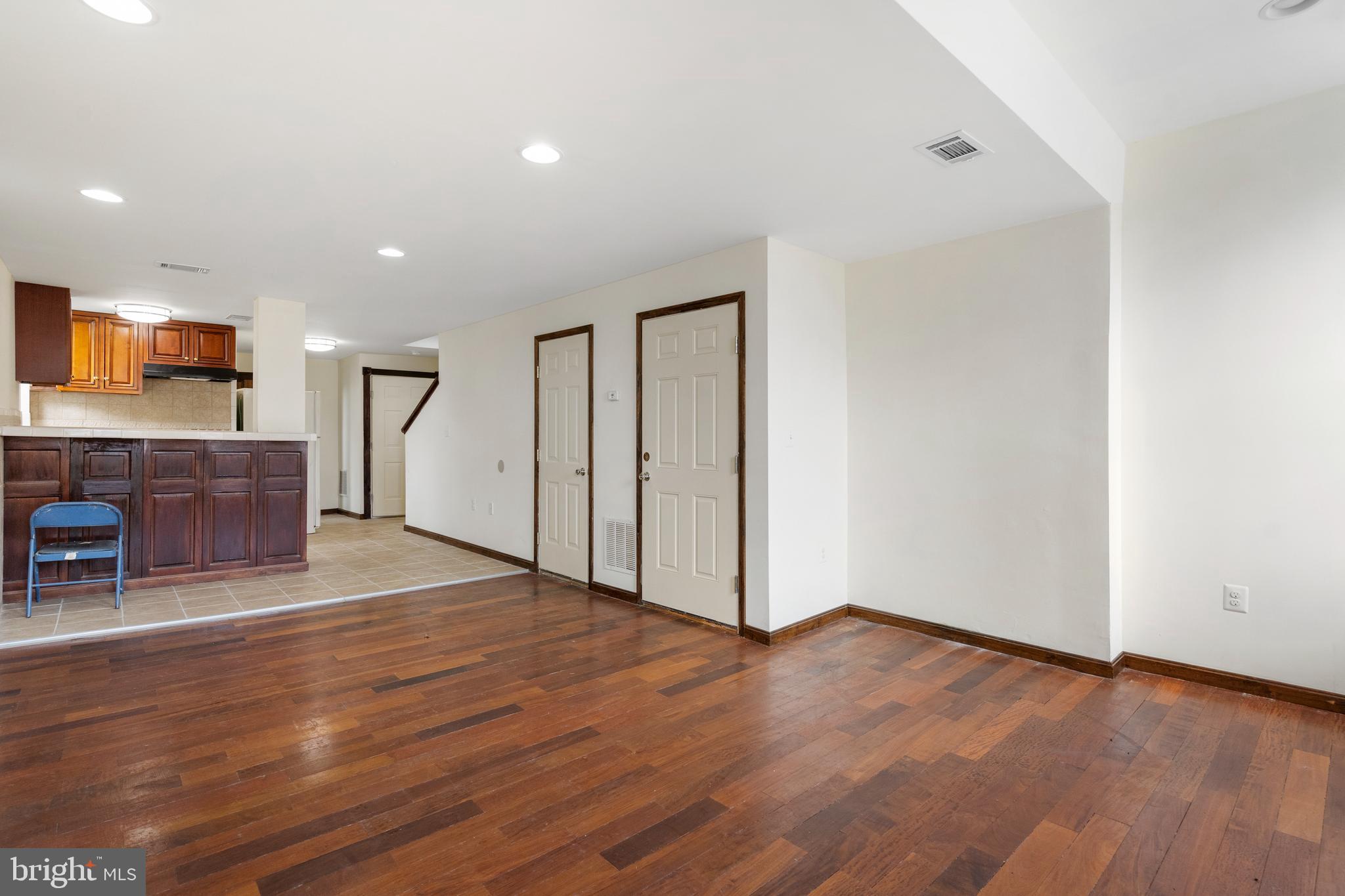 End-of-group mixed-use brick-front rowhome with income potential and charm! The main level is set up for a deli or restaurant, fully equipped and ready to go—with a convenient powder room for staff and guests. Upstairs, the residential space, which has a potential rental income of $1,500, offers an open layout with a spacious kitchen, island prep area, and room for both dining and entertaining. Natural light floods the living area through large windows. A bedroom, full bath with tub/shower combo, and laundry room complete this level. The top floor features two generous bedrooms and another full bath. Live upstairs and run your business below—or rent out one or both units for additional income! Prime location near Reservoir Hill, Druid Hill Park, Route 40, and I-83.
