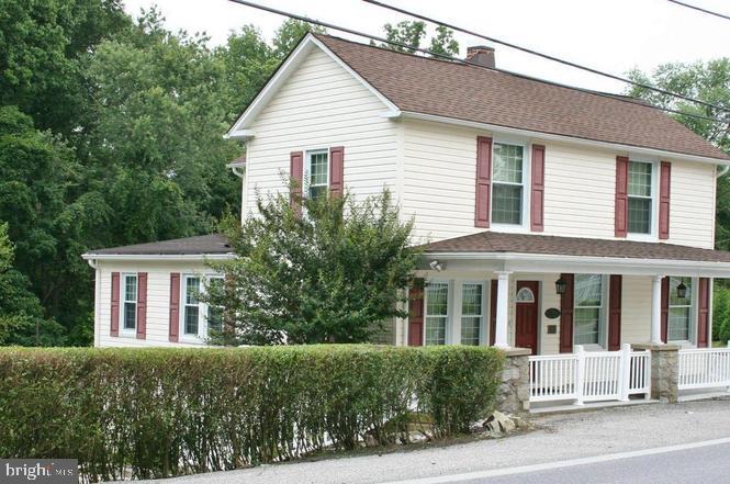 Nestled in the charming Woodstock neighborhood, this exquisite Colonial home, built in 1901, offers a unique blend of historic elegance and modern potential. Set on a generous 0.81-acre lot, the property boasts a partially finished basement, providing ample space for customization to suit your lifestyle needs. The exterior, adorned with classic vinyl siding, exudes timeless appeal, while the expansive driveway ensures convenient parking for you and your guests. Imagine hosting gatherings in your spacious backyard, and large wrap around porch, where the possibilities for outdoor entertainment are endless. Directly across the private paved parking you can enjoy the separate shed equipped with large windows, openly spacious and working electricity! The shed is great for a private office space or workshop. Woodstock is renowned for its vibrant community spirit and proximity to local amenities. Enjoy leisurely strolls through tree-lined streets, where quaint shops and delightful eateries await. The neighborhood is a haven for those who appreciate a blend of tranquility and accessibility, with parks and recreational areas just a stone's throw away, perfect for weekend adventures or evening walks. This property is not just a home; it's a canvas for your dreams. With its rich history and prime location, it invites you to create a sanctuary that reflects your personal style. Experience the charm of Woodstock and the endless possibilities this Colonial gem has to offer. Don't miss your chance to make this enchanting residence your own!
