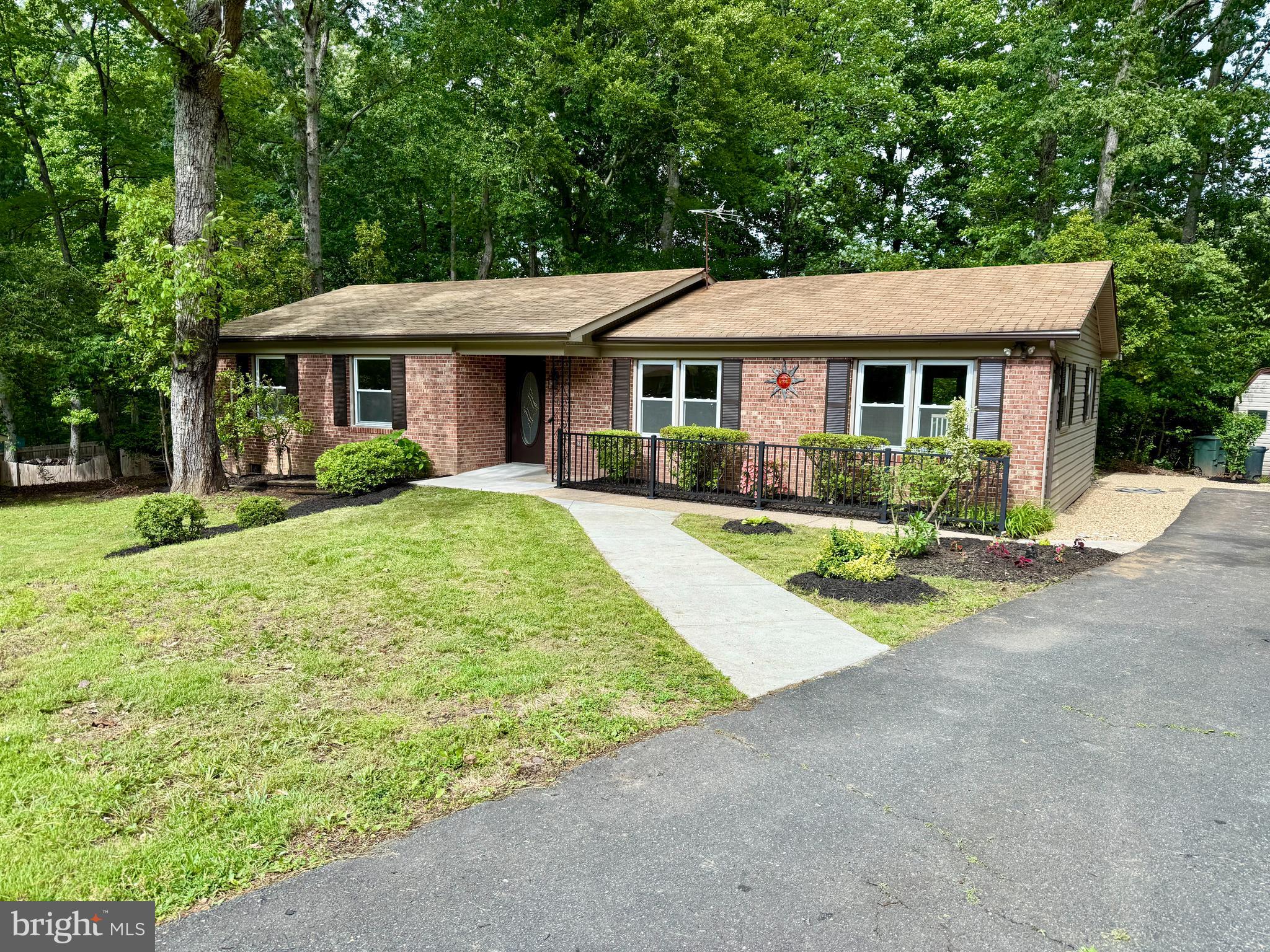 Back On Market At No Fault Of Sellers.  Renovated Brick Rambler on 1.3 Acres in North Stafford – No HOA!
Welcome to 19 Greenridge Drive, a beautifully updated 3-bedroom, 2-bath brick rambler on a private, level 1.3-acre lot in North Stafford. With nearly 1,500 square feet of renovated living space and no HOA, this move-in-ready home blends modern comfort with timeless charm.
Inside, enjoy refinished hardwood floors, fresh paint, and a spacious layout ideal for everyday living and entertaining. The light-filled great room, perfect for both living and dining, opens directly to an oversized back deck.
The updated kitchen features white cabinetry, granite countertops, new stainless steel appliances, and a cozy breakfast nook. Both the kitchen and great room connect seamlessly to the backyard for easy indoor-outdoor living.
The primary bedroom is a peaceful retreat with hardwood floors and a fully renovated en-suite bath. Two additional bedrooms with new carpet share a stylishly updated hall bath, offering comfort for family or guests.
Need flexibility? The large front living room works perfectly as a den, office, or formal dining space.
Out back, enjoy a private, tree-lined yard with room to relax, entertain, or explore. The oversized composite deck is ideal for grilling or dining, and a storage shed adds handy space for tools or seasonal gear.
All this, just minutes from I-95, shopping, and dining. This home offers privacy, style, and convenience—without HOA restrictions.
Don’t miss your chance —schedule your tour today!
