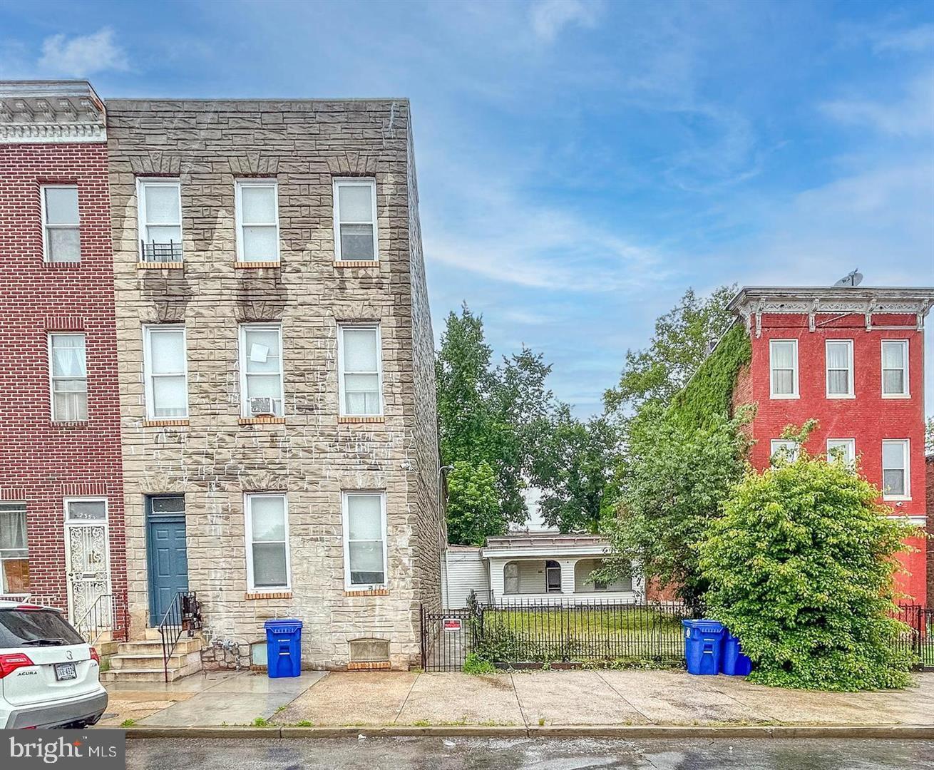 There were many updates in 2024-2025 including flooring, kitchens, bathrooms, walls and more. The building is rent ready with a Baltimore City Rental License allowing for 5 units. Currently, Unit 2 is leased to a Section 8 tenant for $1,239/month on a 2-year lease, while the remaining 4 units are vacant and ready for new tenants. Unit Breakdown: Unit 1 (Main Level) - 1 bedroom, a full bath, bonus room, living area and kitchen. Unit 1F (Main Level) - Studio apartment with 2 rooms, a full bath and kitchen. Accessible via an exterior door on the back right side, marked with a "1." Unit 1E (Detached Casita) – Located at the rear of the property, featuring 1 bedroom, 1 full bath, living/dining area, kitchen, front porch, fenced front yard, and small backyard. Unit 2 (2nd Level) – 2 bedrooms, 1 full bath, bonus room, living/dining area, kitchen, and a covered balcony. (Currently rented for $1,239/month, Section 8, 2-year lease.) Unit 3 (3rd Level) – Located on the 3rd level setup as a studio apartment with a full bath, kitchen and a room with a divided wall. There are 2 entrance doors in the outside hallway into the unit.