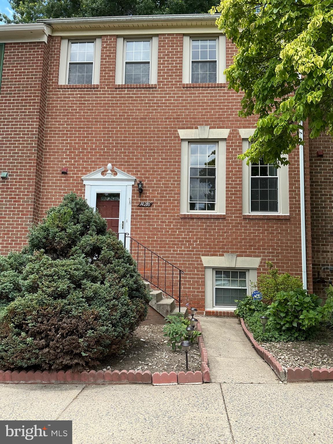This 4-bedroom 3.5 bath 3 level townhome is located in Beacon Place and shows very well. The main level features a foyer/entrance, a powder room, a large living room with hardwood flooring then step up to the dining room with hardwood flooring, a kitchen with upgraded cabinetry, granite countertops, side bar with granite countertop, plenty of storage space and a rear sliding door leading to the fully fenced brick paver patio and storage shed. The upper level features the primary bedroom with a full bath and hardwood flooring, 2 additional bedroom and another full bath. All the upper-level bedrooms all have ceiling fans. The lower level features the recreation room with a wood burning fireplace, storage room, a fourth legal bedroom, a full bath and the laundry/utility room. This townhouse has 2 reserved spaces out in front of the unit. Close to grocery shopping, multiple strip centers, I/370, restaurants and more.