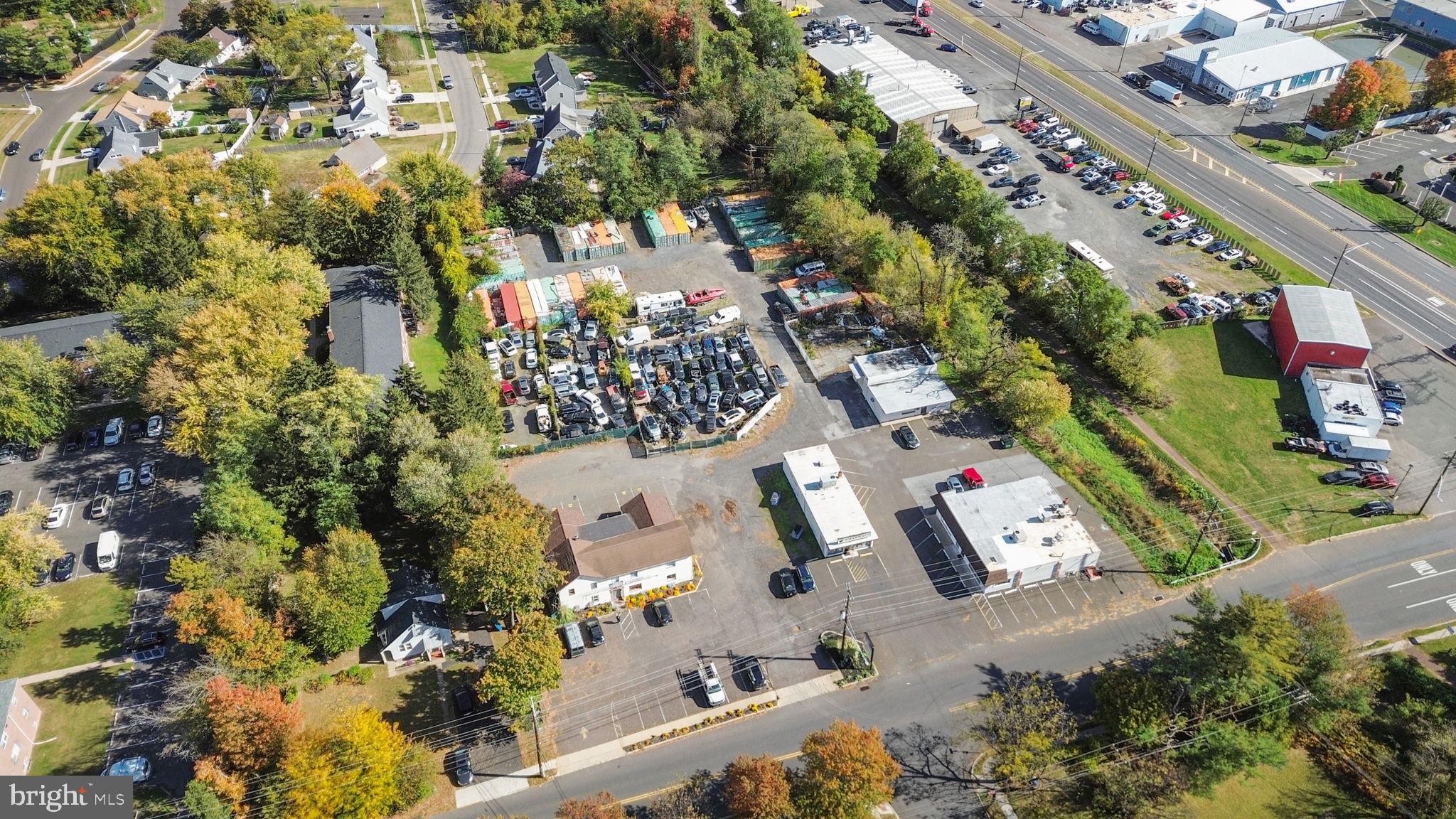 Unique opportunity with multiple rental opportunities on one 2+ acre site including four stand alone buildings as well as lot storage and shipping container storage units; zoned commercial with many different use options