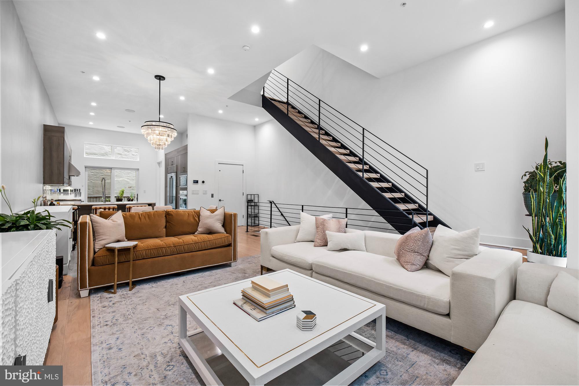 Look no further and make an appointment to see this designer home located in the Old City Community of Black Horse Alley on a cobblestone street and gated private driveway with 2 car garage. This open concept city living 6 level townhome boasts high ceilings and floor to ceiling windows has 4 bedrooms, 4 full baths and 2 half baths and an elevator. Enjoy a large kitchen with quartz countertops, wolf and sub zero appliances and plenty of cabinet space for storage. The comfortable size family room delivers plenty of natural light. Unwind in your own Sauna Room in the lower level entertainment space with a full bathroom and space can be used  for gaming or movie nights. Make your way to upper levels and you will find 2 bedrooms with full baths and a 3rd Bedroom that is currently being used as a home office. All with a walk in closet space. The owners suite has its own floor and the bath has been recently renovated and features a soaking tub and a frameless shower with dual controls. A bonus space on the top level as an extra entertainment space with its 2 decks to enjoy the view of the Delaware River and city skyline. Walk to the many restaurants in the area and historical attractions. Easy access to major highways and bridges to New Jersey. Pack Your Bags!