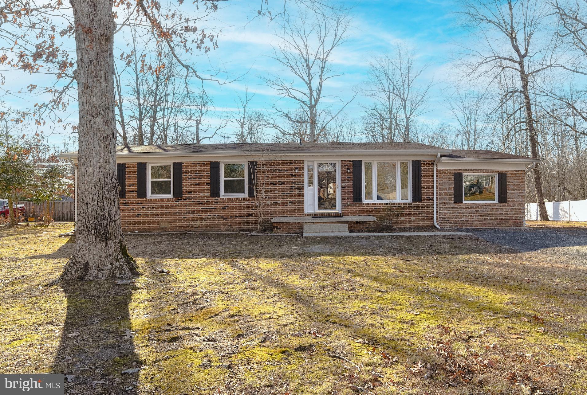 Pleasant 3-bed brick-front rambler on just over a half acre lot. Plenty of space and easy living, with a huge backyard! This home has a large living room, plus a bonus room/FR. A spacious kitchen with brand new stainless steel appliances. All new flooring -- LVP in living areas and carpet in the bedrooms. The entire interior has fresh paint. Updated bathrooms. A new laundry area in the bonus room/FR. New recessed lighting. Level, private backyard, view of the woods behind. This home is clean and ready for new owners. Located at the cul de sac end of the street, no thru traffic. Just minutes from key amenities, easy access to 235. Short commute to Patuxent River Naval Air Station. Budget-friendly home, move-in-ready!