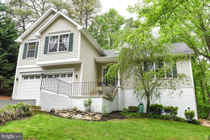 Beautiful 4 level home w/an additional lot for a total of almost 1/2 acre.  Open floor plan w/ cathedral ceilings, kitchen w/breakfast area, doors open to deck and patio.  Finished recroom, basement bedroom w/full bathroom, wood stove, tons of storage.  2 Car Garage, separate parking pad for additional vehicles.  Must see this home to appreciate all of the space it has to offer. Cartus Relocation