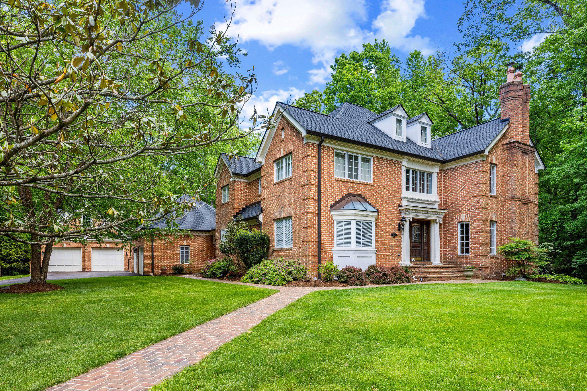 Sited on a quiet cul-de-sac in prestigious Belvoir Farms, this beautifully maintained French inspired 7,000 square feet home boasts refined living space on an exceptionally private one-acre homesite - rare for the community. The property is completely surrounded by open space with mature trees and serene woodlands, and provides a level of seclusion and tranquility that sets it apart from many others.
The home features a new roof and driveway (2025), offering both peace of mind and curb appeal. Inside, there are many new or upgraded amenities such as marble, granite, and onyx countertops, flooring, and closets. The main level showcases a formal living room, spacious family room, and elegant dining room, along with an eat-in kitchen equipped cherry cabinets and professional-grade appliances - ideal for everyday living and entertaining. A versatile main-level bedroom can also serve as a sun-filled morning room, private office, or guest apartment. Rooms on all levels are appointed with custom millwork trim.
Upstairs, the primary suite is a true retreat, complete with a cozy fireplace and custom-designed closet. The primary bath features a skylight, whirlpool bath, bidet, and marble counter and shower with side sprays. Three additional bedrooms provide generous accommodations, while the finished third level offers flexible space for a fourth bedroom, studio, or home office.
The fully finished lower level is designed for entertaining, featuring a media room, expansive recreation area with fireplace, powder room, closets, and a full custom bar with sink, dishwasher, Viking refrigerator, and Sub-Zero wine/beverage fridge. A bonus room adds even more versatility for a gym or hobby space.
Outdoor living is equally impressive, with an expansive terrace with natural travertine paving, outdoor Viking kitchen, and a heated saltwater plunge pool with smart technology - creating a private resort-like experience at home. The property also includes an attached 24’ x 26’ oversized 2-car garage with storage cabinets. A detached 24’ x 26’ oversized 2-car garage includes a storage closet, in-wall heaters, and finished space above, ideal for a studio, office, or guest suite. The property has an irrigation system, landscape lighting, and emergency backup generator.
The Belvoir Farms community offers a lifestyle unlike any other, with abundant open space, scenic walking trails, and gate accessible private marina on the Severn River via Maynadier Creek - just a short walk along the private trail from this home. Residents enjoy a boat ramp, kayak launch, fishing and crabbing pier, and boat slips available for rent or purchase, making waterfront living easily accessible. The community also features tennis and pickleball courts, a playground, and natural wildlife areas. 
Ideally located just across Generals Highway from the newly renovated Preserve at Eisenhower Golf Course providing access and amenities comparable to a community owned Golf Course without expense of a membership. This property is located within minutes to Route 50 and I-97 for easy access to BWI Airport, Washington, D.C., Baltimore and Delaware. This home combines luxury, privacy, and convenience in one exceptional offering.
Welcome Home!