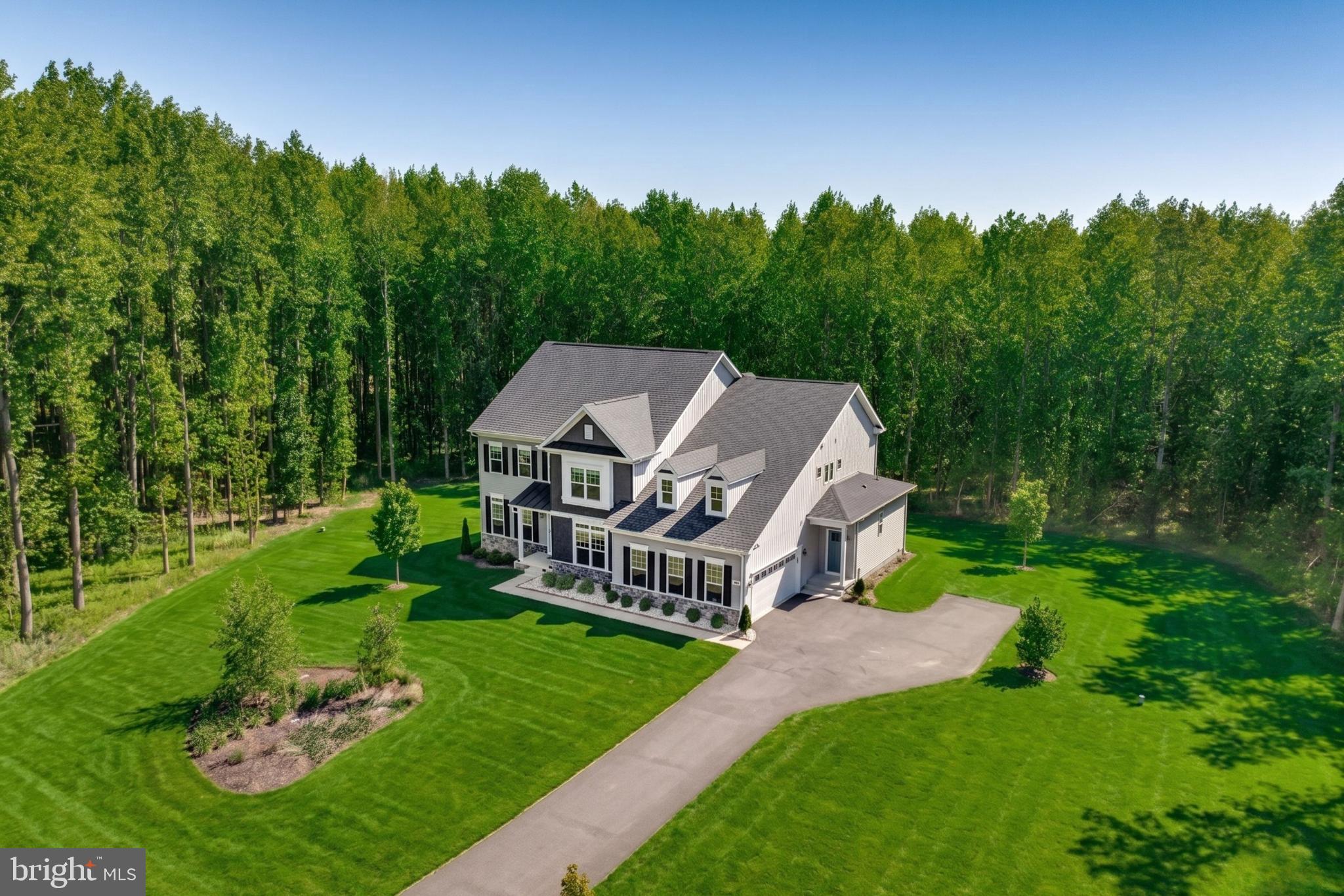 This stunning home offers a rare combination of comfort, style, and functionality, set on a peaceful, expansive lot that stretches over 5 acres. Nestled in a serene environment, this property backs to mature trees, providing both privacy and natural beauty.
The thoughtful open-concept layout creates a welcoming atmosphere, featuring high-end finishes throughout. The heart of the home includes a gourmet kitchen with a walk-in pantry, while a butler’s pantry ensures easy access for all your culinary needs. The master suite, a true retreat, boasts two cozy sitting areas, a luxurious walk-in shower, and a freestanding tub perfect for relaxation. A convenient temperature control system allows for customized hot water settings in the master suite, adding an extra level of comfort.
The home is designed with ease and convenience in mind. A Jack and Jill bathroom with double vanities ensures ease for shared spaces, while laundry facilities are conveniently located upstairs. Enjoy modern conveniences, including smart thermostats and motion lights around the house. A well-thought-out drainage system and backup battery for the sump pump ensure peace of mind, even during the harshest weather.
For visitors or extended family, an in-law suite with a separate entrance offers both independence and comfort. Outside, the property is fully equipped with a sprinkler system and a well-maintained yard, ideal for outdoor activities or peaceful relaxation.
With plenty of space for entertaining, a professionally designed layout, and multiple luxury features, this home is not just a place to live, but a lifestyle to experience. Photos may be virtually staged