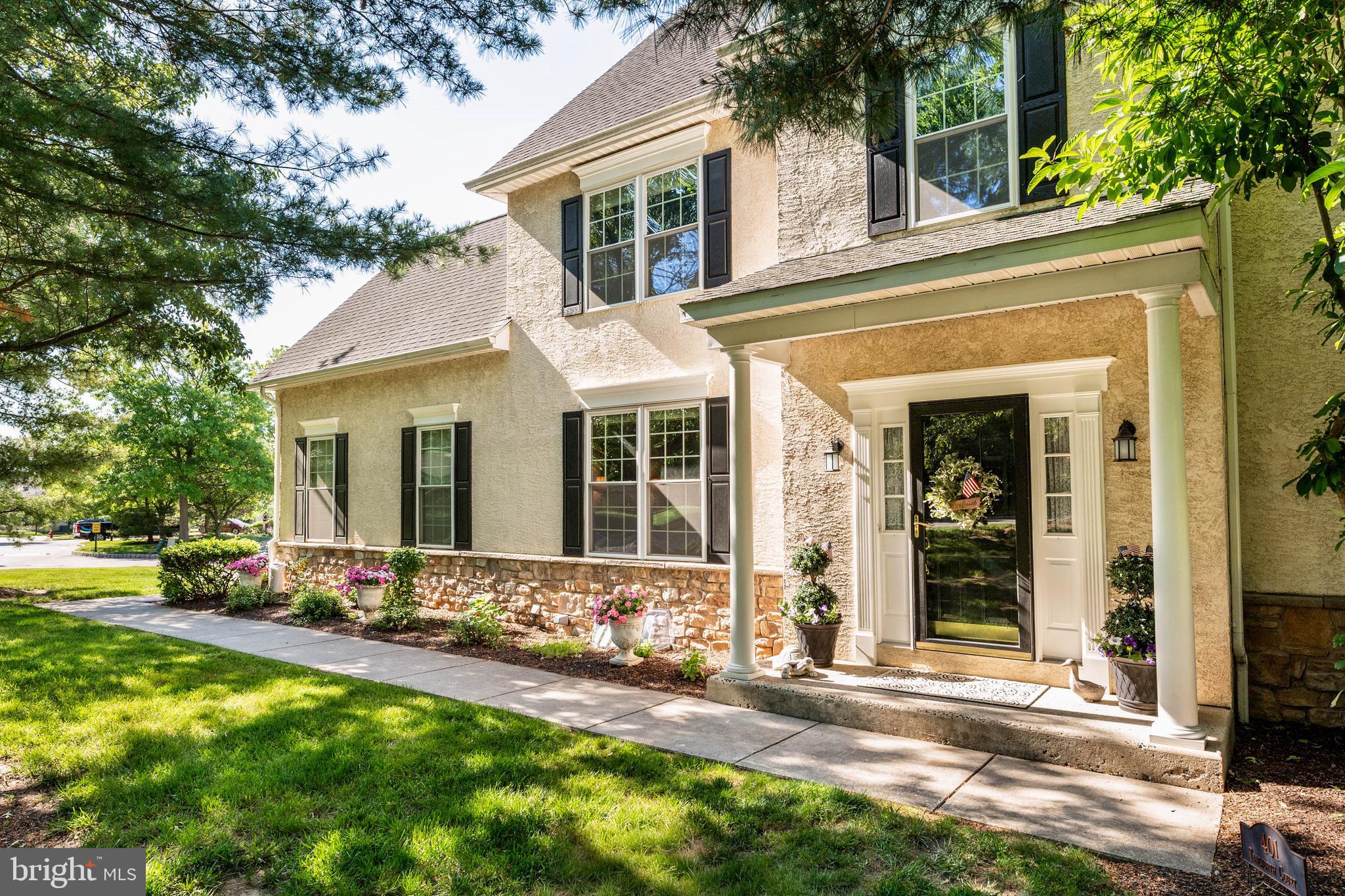 Welcome to 401 Tamworth Court, an exceptional end-unit carriage home in the highly sought-after Yorkshires of Blue Bell community that has been thoughtfully and extensively transformed by its current owner. Since purchasing the home in 2023, more than $200,000 has been invested in high-quality renovations and upgrades, creating a truly move-in-ready residence unlike any other in the neighborhood.

Perfectly situated on a quiet cul-de-sac and backing to open space and mature trees, this Brighton model offers over 3,500 square feet of living space on three levels.

From the moment you enter, you'll appreciate the fresh, modern aesthetic featuring new luxury vinyl flooring throughout the second level, freshly painted interiors, upgraded lighting, designer fixtures, and numerous thoughtful improvements. The spacious kitchen has been refreshed with all-new LG stainless steel appliances, a farmhouse sink, new faucet, garbage disposal, updated hardware, and enhanced lighting, creating a stylish and functional gathering space.

The dramatic two-story family room remains the centerpiece of the home, showcasing soaring ceilings, a wall of windows, and a gas fireplace with a completely upgraded burner and remote-control system. The adjoining breakfast area opens to a stunning maintenance-free Trex deck, newly constructed with stairs leading to the yard, providing the perfect setting for outdoor entertaining while enjoying peaceful views of the open common area beyond.

Upstairs, the luxurious primary suite has undergone a remarkable renovation. The completely redesigned primary bath features an expanded tile shower, custom cabinetry, marble countertops, new lighting, mirrors, fixtures, and a dedicated makeup area, creating a spa-inspired retreat. Two additional generously sized bedrooms and an updated hall bath complete the second floor.

The lower level has been fully finished and thoughtfully designed with luxury vinyl flooring, recessed lighting, custom cabinetry, fresh paint, upgraded electrical service, and extensive insulation for both sound reduction and energy efficiency, adding valuable living and entertaining space.

Additional recent improvements include a new hot water heater, new garage door opener, new LG washer and dryer, upgraded plumbing fixtures and shut-off valves, radon mitigation system, ductwork improvements with air scrubber, Lennox smart thermostat, duct cleaning, exterior painting, ceiling fans, electrical upgrades, and more. The home also benefits from Verizon Fiber internet service, transferable warranties, and ongoing HVAC and pest maintenance programs.

As an extraordinary bonus, the seller has prepaid the HOA fees through the end of 2026, providing significant savings and added value for the next owner.

Located within the award-winning Wissahickon School District and just minutes from Blue Bell's shopping, dining, parks, and major commuter routes, this is a rare opportunity to own a beautifully updated home in one of Montgomery County's most desirable communities. Simply unpack and enjoy.