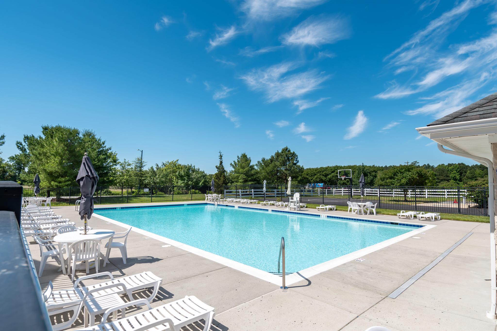 PRICE IMPROVEMENT*** Discover the charm of Lakelands at Easton, where community spirit meets modern living in this stunning coastal-style townhouse. Built in 2010, this beautifully maintained home boasts 4 spacious bedrooms and 3.5 bathrooms, offering ample space for relaxation and entertainment. The inviting exterior features well-kept sidewalks that encourage evening strolls and friendly neighborly chats. Step outside to enjoy the community amenities, including basketball courts and a refreshing outdoor pool, perfect for summer gatherings and active lifestyles. The vibrant neighborhood is designed for connection, with parks nearby that provide green spaces for picnics, playdates, and outdoor activities. The community's commitment to safety and convenience is evident, with public services readily accessible, making daily life a breeze. Inside, the home features a cozy gas fireplace, ideal for creating warm memories during chilly evenings. The improved basement offers additional living space, while the attached garage and driveway provide ample parking for guests. With a lot size of 0.09 acres, this property strikes the perfect balance between manageable upkeep and outdoor enjoyment. Embrace a lifestyle where community, comfort, and convenience come together seamlessly in Lakelands at Easton. Don't miss your chance to make this delightful townhouse your new home!
**New AC 2024, Five New windows with warranty, New Roof Ridge top peak and vents through Marasun 2025, Gas Fireplace-all new parts 2026, 2019 Replaced wood Decking with Trex decking, Only One of 4 units that has 4 bedrooms.**