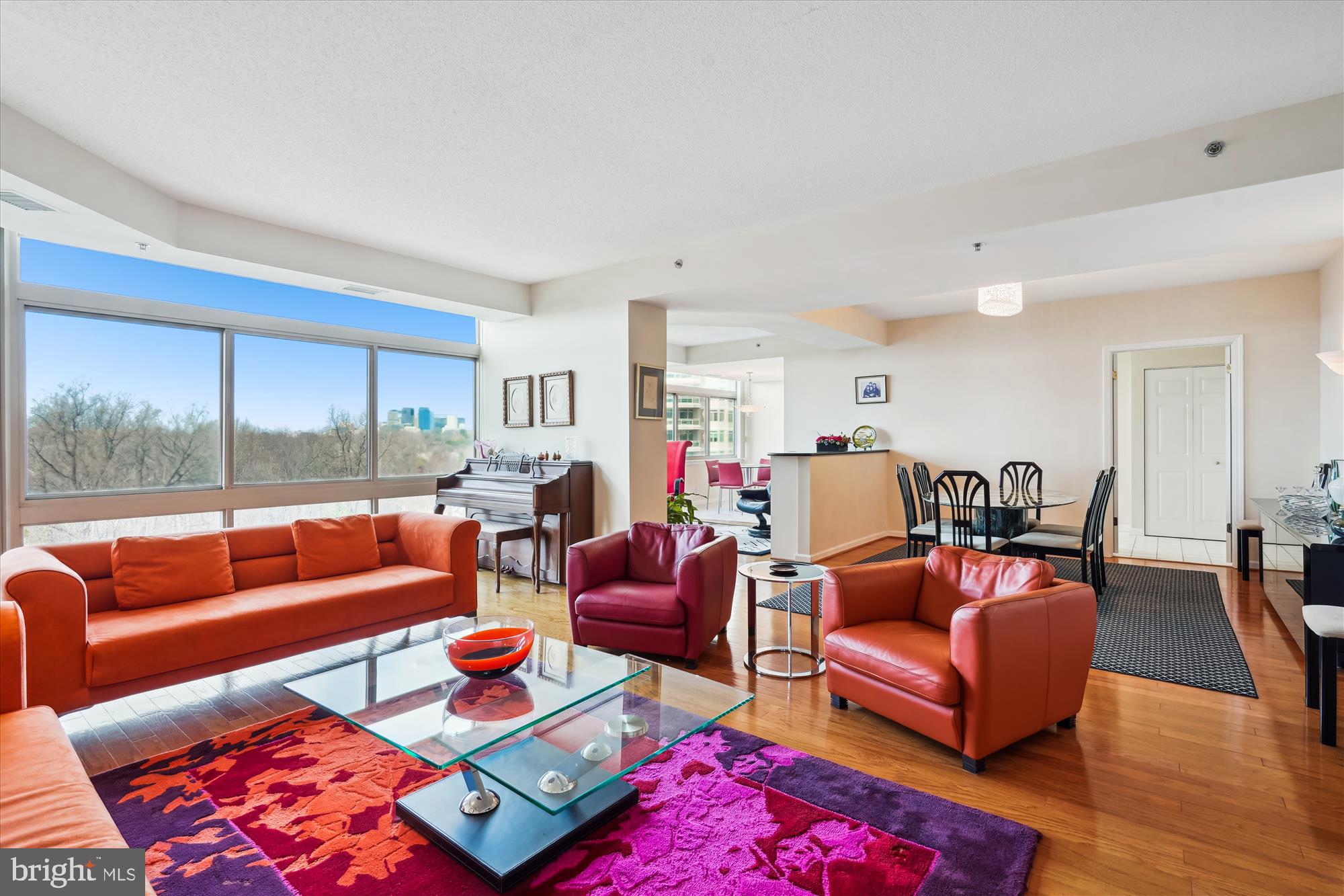 You will love this very sought after tier because of amazing unobstructed views from every room!  Foyer entry with 2 closets and a powder room,  large and open living room, dining room and den (with hardwood floors) next to the breakfast room and kitchen.  A primary bedroom suite with huge walk-in closet and primary bath has double vanity/sinks, plus separate tub and shower.  The 2nd bedroom has an ensuite bath with tub/shower.  Large balcony with access from the living room and the two bedrooms!  2 garage parking spaces (G2-150 & 151) and a large storage unit (G3-68) conveys with the sale.  Sellers require a rentback through Oct/Nov.

Experience elegant, resort-like living in the most luxurious complex in Friendship Heights, situated on 17+ acres.  Gated community with gatehouse, 24-hour security, the 3-story clubhouse with heated indoor/outdoor pools (with lifeguards), party rooms, state-of-the-art fitness center, racquetball court, billiards & ping pong rooms, aerobics room, art/hobby room, tennis/pickle ball courts, lushly landscaped grounds & walking paths!  Easy stroll to the shops, grocery, dining, and Friendship Heights Metro.