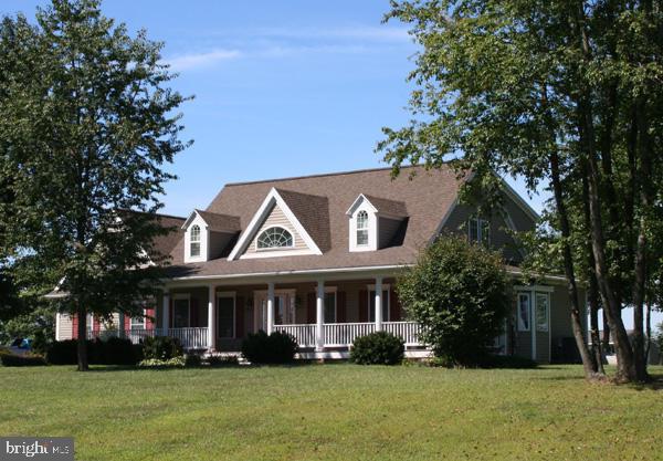 Spectacular, light-filled 6 year old cape in an exquisite country setting. This home has it all: open floor plan, 1st floor master suite w/WIC, double vanities, soaking tub & shower, 2 story windows, vaulted ceiling, hwd floors, beautiful kitchen w/WI pantry, island & upgraded appliances, FR FP, sunroom, loft, deck, 2 balconies, wonderful views & fabulous wrap around porch! Must see!