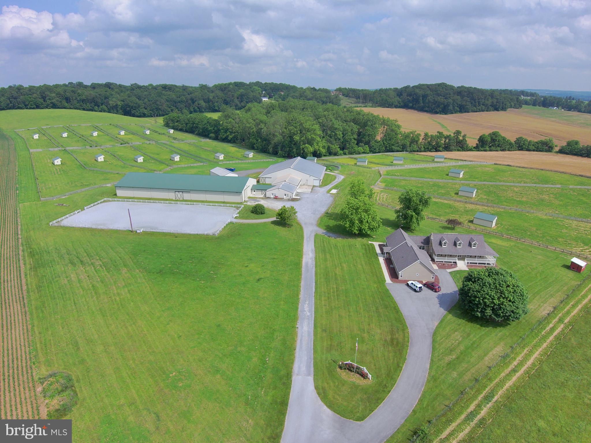Premier Equestrian Center on 50 Scenic Acres — Featuring Two Full Residences

This state-of-the-art, full-service equestrian facility is a rare turnkey opportunity for serious equine professionals or aspiring entrepreneurs. Situated on 50 picturesque acres, this meticulously upgraded property offers everything you need to board, train, host clinics or shows, and build your dream career in the equine world.

Residences:

Main Farmhouse plus Full-Size Attached In-Law Suite — two complete homes perfect for multi-generational living, staff housing, or rental income.

Equestrian Facilities:
Arenas & Riding Areas

200x80 Indoor Arena with brand-new LED lighting, climate-controlled viewing/judges room with A/C, heat, and sound system for announcements and music.

200x100 Outdoor Arena with lighting and water hydrant.

Grass Dressage Arena with integrated obstacle course.

Stabling & Barn Amenities

29 numbered 12x12 stalls in spacious indoor barn

5 grooming stalls + 4 hot/cold water wash stalls in dedicated wash building

Heated/A/C Tack Room with 29 lockers and ceiling fans

Owner’s Office with new flooring, A/C, heat, and Wi-Fi

Boarders’ Lounge with kitchenette (granite counters), ceiling fans, and half bath

Feed/Employee Room with built-ins, new lighting, A/C & heat, fridge, wash sink, and potential upstairs apartment

Pasture & Turnout

19 fenced paddocks with run-in sheds and automatic waterers (designed to open into larger pastures)

7 additional acres of fenced pasture

New 4-board fencing with electric and all-new gates

Additional Features:
3-Bay Garage / Hay & Equipment Barn with 12x12 doors, electric, and lighting

Tool Shed with new roof, siding, and electric

Outdoor Wash Stall

24 lockers for field boarders

6 Big Ass Barn Fans

Security Camera System

Custom Barn Doors

Manure Pit

4 exterior hydrants around the barn

Two 50-amp RV hookups

All-new exterior lighting

Potential for future cross-country course

This exceptional facility has been fully updated over the past five years and is ready for immediate operation. Whether you’re looking to run a boarding business, training program, show series, or clinic venue, this property offers unmatched versatility and income potential.

Build your equestrian legacy here — the possibilities are endless!