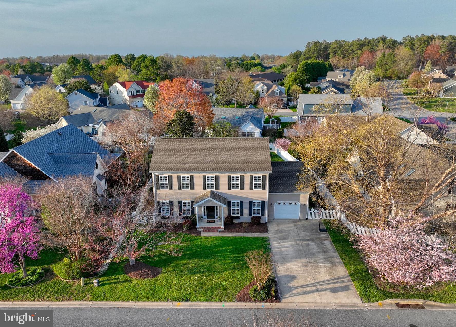 STYLE, COMFORT and IN-TOWN LEWES LIVING is yours with this charming colonial style home in highly desirable Pilottown Village! This 4-bedroom 2.5 bath beautifully maintained home is freshly painted and offers an ideal setting for year-round enjoyment. The home features an open floor plan, formal dining room, country kitchen with breakfast bar & sleek stainless steel appliances - including built-in SubZero refrigerator, hardwood floors thru-out the first level, 2 inviting fireplaces, high-end plantation shutters on both floors, & a custom walk-in closet in the primary bedroom. Additional recent upgrades include crawlspace encapsulation with dehumidifier, in 2020: new 50-year roof shingles & energy efficient HVAC; in 2023: energy efficient tankless waterheater & remodeled laundry room, and the list goes on! To top it all off, there is an inviting three-season room that overlooks the large beautifully  landscaped yard that's clearly made for relaxation and entertainment -  with paver patio, 6+ person hottub, & a convenient outdoor shower. All of this is just a short bike ride or walk to the downtown Lewes dining and shopping attractions and the beach! Call now to schedule your private tour - and start you intown Lewes beach life!