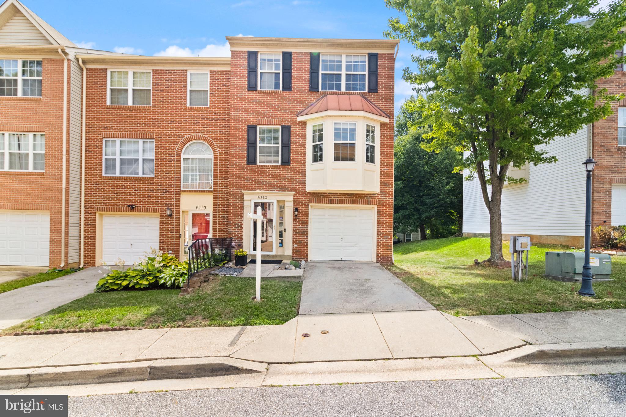 Welcome to 6112 Kildare Court, a beautifully maintained townhome offering four fully finished levels of comfortable living in a convenient Fort Washington location. A stunning brick façade, private driveway, and one-car garage create excellent curb appeal, while large windows throughout fill the home with natural light.

The main level features an inviting eat-in kitchen and spacious living areas designed for everyday living and entertaining. Upstairs, you'll find three generously sized bedrooms and two full bathrooms, including a private primary suite. The fully finished lower level provides exceptional flexibility with a bonus room, and laundry area.  Sliding glass doors on the entry level lead directly to a deck overlooking a grassy common area, creating the perfect space to relax, play, or enjoy the outdoors. Combining functional living spaces, abundant natural light, and versatile indoor-outdoor living, this home is ready for its next owner.