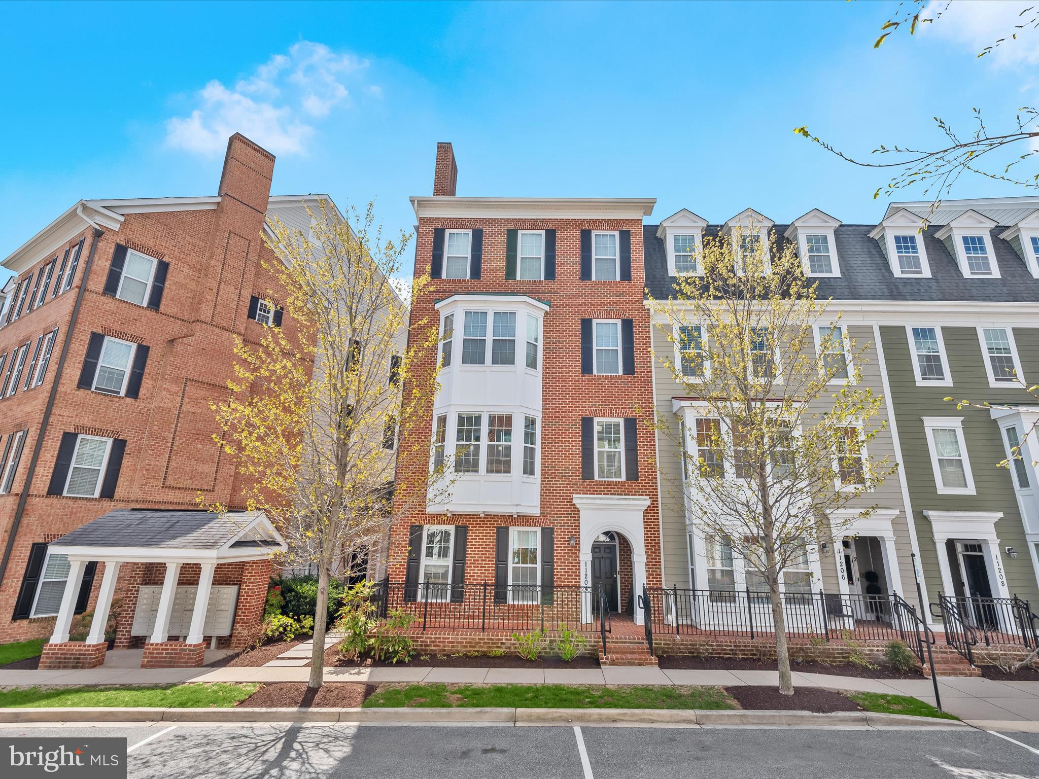 ***OFFER DEADLINE Monday April 21st***Welcome home to a beautifully designed end-of-group two-story condominium located in the desirable Midtown District of Maple Lawn! This prime location offers convenient access to the community center, pool and gym while still providing tranquil views of the pond and open space to the rear. Pristine wood flooring, bright interiors and crown moldings put the finishing touches on this modern and functional floor plan. The first level features a front bedroom, a half-bath recently refreshed with designer vanity, fixtures and new flooring, two generously sized closets, and access to the private attached garage. 

The second level offers inviting living and dining areas complete with a bay window bump-out. The kitchen features granite countertops, 42” cabinetry, stainless steel appliances, and a breakfast bar for additional seating. The primary suite is a peaceful retreat complete with a walk-in closet and luxurious bathroom with large shower and double vanity. An additional bedroom, full bath, and laundry area further enhance this exceptional home. Conveniently located close to all major Baltimore/DC commuter routes, and with enviable amenities including a resort-style community pool, tennis courts, pickleball courts, basketball courts, state-of-the-art gym and more, you’ll quickly see why Maple Lawn is one of the most sought-after communities in the region. Hurry! 11204-1 Chase Street won’t last long.