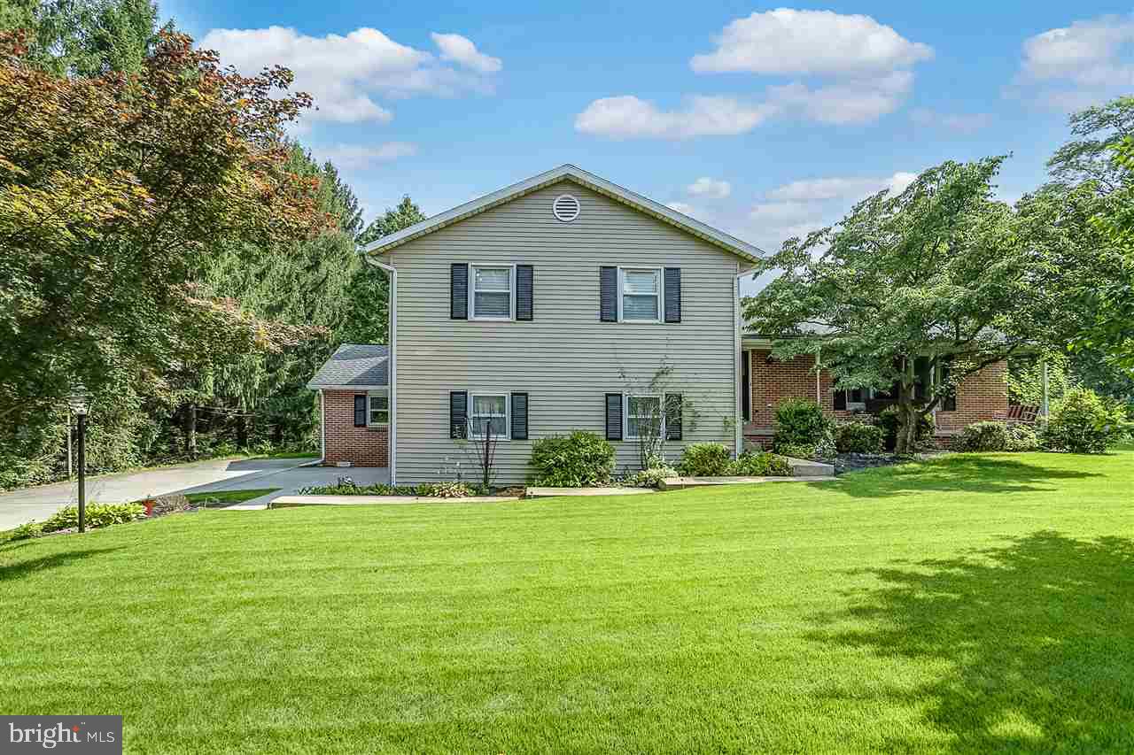 This 5 bedroom split level home is located in the Carlisle Area School District. First floor includes a large living room, formal dining room, large eat in kitchen with breakfast bar and breakfast nook, large family room and game room. There are several fire places in the home. There is a wood fireplace in the master bedroom, a wood stove in the breakfast nook and a wood fireplace in the family room. Along with the home is a beautiful sunroom overlooking the private back yard. Do not miss out on this home!
