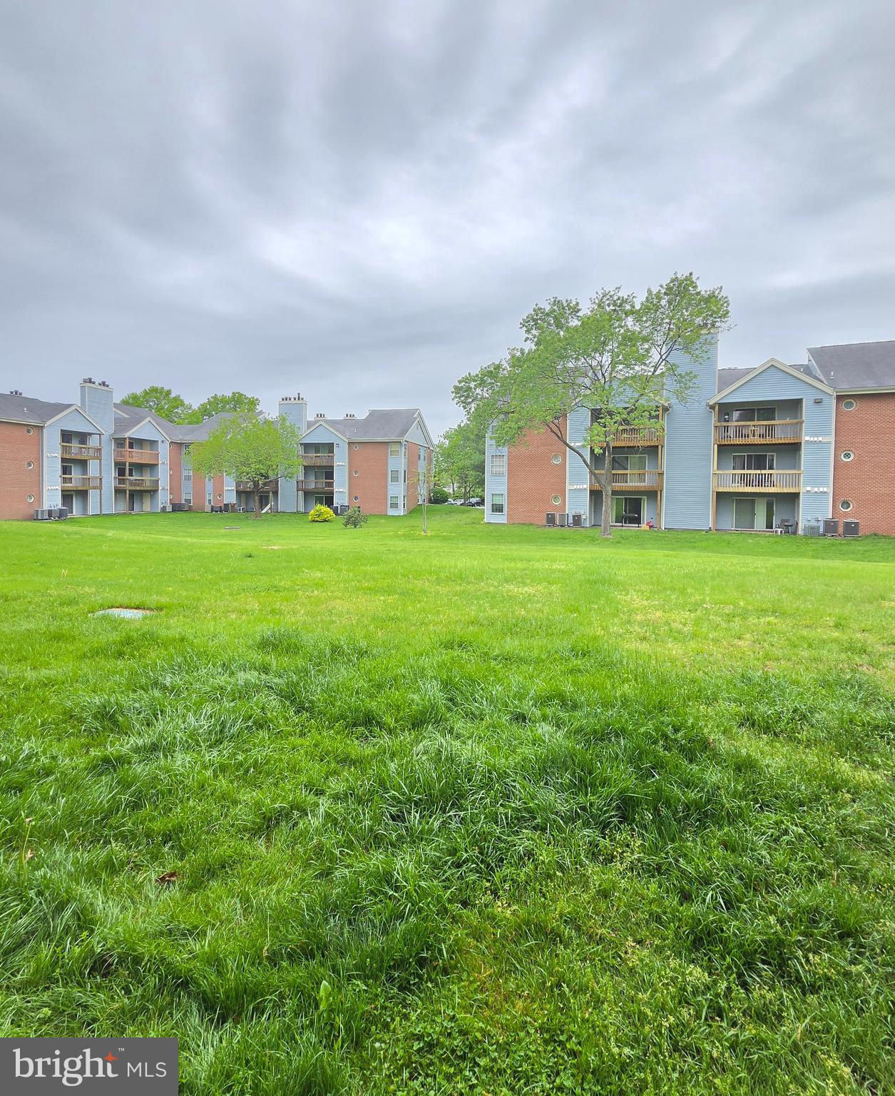 Welcome to this well-maintained and freshly painted 2-bedroom, 2 full bathroom first-floor condo offering comfortable, easy living with a functional open layout. The kitchen features a pass-through window with bar seating, creating a seamless connection to the living area, perfect for everyday living or entertaining. The living room is warm and inviting with a cozy fireplace and direct access to a sliding glass door that leads out to your private patio and the common grounds, ideal for enjoying a little outdoor space right at home. Both bedrooms are nicely sized, including a primary suite with its own full bath. The first-floor location offers added convenience, and this building is one of the few in the community that includes an exterior ramp for easier access. 

If you’re looking for low-maintenance living with a comfortable layout and conveniently located near multiple shopping centers, this condo is a great opportunity.  Schedule your showing today!