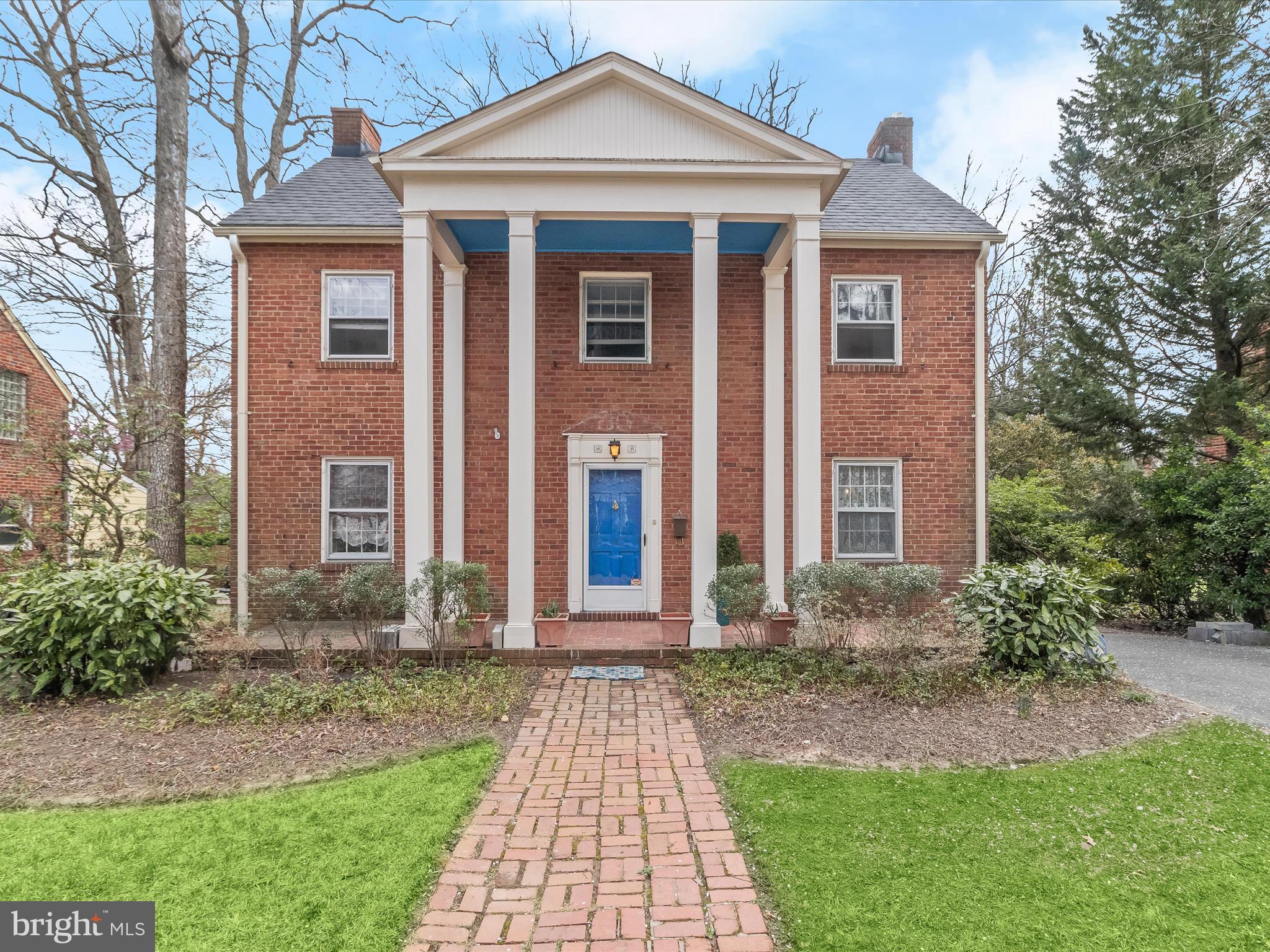 Nestled on a tree-lined street, this brick colonial blends timeless charm with thoughtful updates. A classic brick walkway welcomes you inside, leading to a bright foyer flanked by formal living and dining rooms. The living room exudes warmth with a wood-burning fireplace framed by rich brick accents, while the dining room, with elegant chair railing, flows seamlessly into the well-appointed kitchen. Here, sleek appliances, including a Bosch dishwasher and a Jenn-Air range, complement the durable flooring, making meal preparation a pleasure. Beyond the kitchen, the inviting family room offers a comfortable space to unwind, featuring a sliding glass door that opens to a covered deck—ideal for entertaining or quiet mornings with coffee. A nearby laundry room, equipped with a recently replaced washer and dryer, adds convenience, along with a half bath. Further still, an attached greenhouse with a built-in sink provides a dream space for plant lovers. Upstairs, the primary suite is a true retreat, offering a private deck overlooking the lush backyard, a walk-in closet, and a stunning modern en-suite bath. Thoughtfully renovated, the bathroom boasts a sleek tiled shower with a rain shower head, a floating vanity, and towel warmers for added luxury. Four additional bedrooms share an updated full bath, while a walk-up attic offers abundant storage and a whole-house fan for added ventilation. The partially finished lower level expands the living space with a recreation room complete with a projector and screen—perfect for movie nights. A separate utility room is ideal for a workshop or extra storage. The oversized, extended one-car garage provides even more flexibility, with space for a work area and an attic storage area illuminated by a skylight. Outside, the private, fenced backyard is a serene escape with a dedicated play area and raised garden beds, all framed by mature landscaping. The home’s practical updates include a recently replaced furnace and roof for added peace of mind. Located in the Calvert Hills neighborhood just 2 blocks to (the Riverdale Park Station development) Denizen's, Burton's, Whole Foods, Le Fantome. Close to Trader Joe's & UMD. Enjoy all that the Calvert Hills neighborhood offers including annual events organized by the Calvert Hills Citizen's Association like the Ice Cream Social, Halloween Parade and Kickball and BBQ. A home where classic elegance meets modern comfort—don’t miss this incredible opportunity!