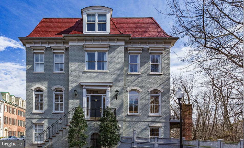 This stunning Royal model is a light filled, end unit townhome that  features a gorgeous mansard roof,  three bedrooms, two full bathrooms and two half baths and a two car garage.   Highlights  include two levels of outdoor resort-like  living and one of the largest lower level patios in the neighborhood.  Enjoy views of lush greenery  on three sides, and watch the local wildlife while having your morning coffee on one of two outdoor spaces.   Steps to the Mt. Vernon walking trail and  to the Potomac River,  this location is  ideal  for  walkers,  joggers and dog lovers alike!   Walk to shops, restaurants and King Street -   It doesn't get much better than this in the southeast quadrant in Old Town Alexandria.   This home is more than a house, it is a lifestyle.   Live where you love!