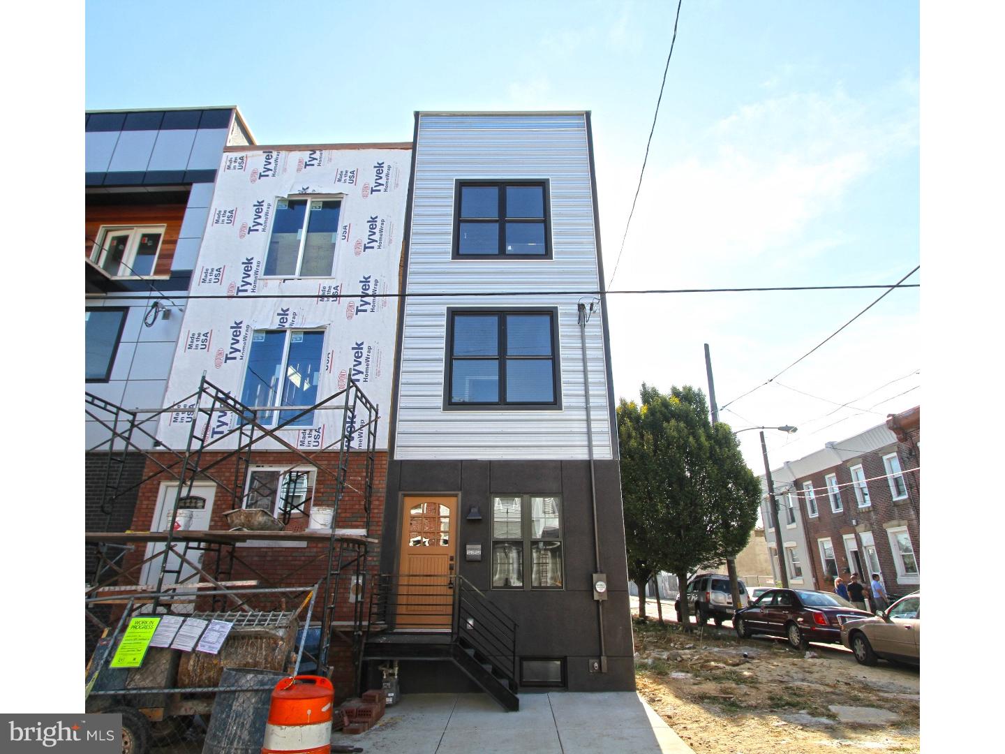 Here it is, brand new construction in Fishtown, completely built and ready to go!  This home has modern and sleek design, 9+ foot ceilings throughout, large windows, solid 3/4 hardwood flooring + recessed lighting. 1st floor has open layout that leads to chef's kitchen w/ 42inch cabinets, quartz counters + stainless steel appliances, complete with a powder room, leading to a spacious 15 foot rear patio area.  2nd floor has two spacious bedrooms, full bathroom +  huge laundry closet.  3rd floor master suite has a generous sized bathroom with double extended vanity, 6 foot shower and gigantic California style walk-in closet. Stairs lead to a 450 square foot fiberglass roofdeck w/ panoramic views of the city!  Finished basement w/ egress provides additional square footage and is ideal your media room.  200 amp electrical service, sprinkler system, high efficiency dual zoned HVAC system.  10 year tax abatement has been applied for, annual real estate taxes of $119 annually!  Located close to I-95, shopping, bars, cafes, restaurants, rec centers and so much more.