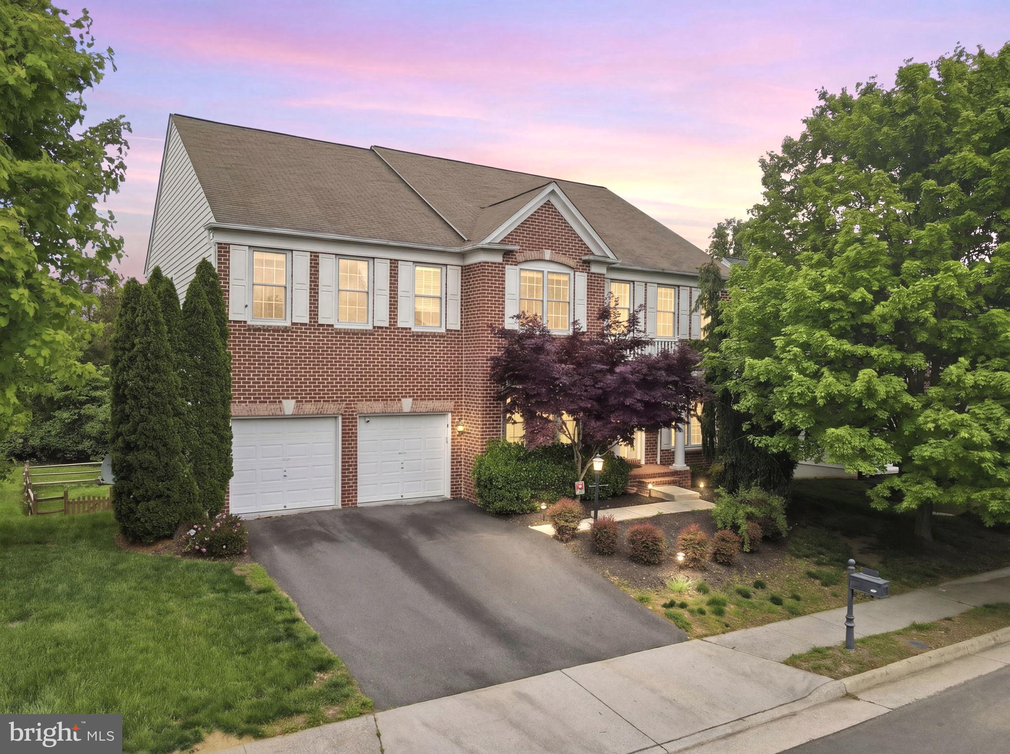 ***OPEN HOUSE 06/07 Sunday 2-4PM  ***Renovation work is completed last week, including  ; new LVP flooring in the basement; updated kitchen countertops, cooktop, sink, and faucet; and fresh neutral paint throughout the entire home except office room.  Updated photos will be available on Wednesday, June 3rd!

Welcome to this beautifully maintained home in the highly sought-after Ridings at Blue Spring community. This classic red brick colonial offers 5,634 square feet of thoughtfully designed living space, featuring 5 bedrooms and 4.5 bathrooms.

Situated on a premium lot, the main level welcomes you with a dramatic two-story foyer and an elegant French-door office featuring a bay window. Beyond the formal living and dining rooms and a conveniently located powder room, the home opens to a bright, airy family room with 9-foot ceilings and a gas fireplace—perfect for both everyday living and entertaining. The family room flows seamlessly into a gourmet kitchen complete with a large center island, breakfast bar, and abundant cabinetry, and continues into a generously sized breakfast area overlooking the backyard with direct access to the outdoor deck.  

The upper level features a thoughtfully designed layout with four spacious bedrooms. The expansive primary suite serves as a true retreat, offering a sitting area, a two-sided gas fireplace, a high tray ceiling, a generous walk-in closet, and a well-appointed en-suite bath with dual vanities and a spa-like soaking tub. Each secondary bedroom includes its own closet, and a conveniently located second-floor laundry room enhances everyday living.

The fully finished walkout lower level is filled with natural light and offers direct access to the backyard. Designed for entertaining, it features a movie theater–ready setup and a built-in wet/dry bar. A spacious fifth bedroom on the lower level, complete with a large window, full bathroom, and walk-in closet, provides a perfect private guest en-suite.  

The property also boasts a fully fenced, private, flat backyard—perfect for outdoor entertaining, play, or quiet relaxation. Enjoy outdoor living on the custom-built deck complete with a gazebo and steps leading to the yard, creating an ideal setting for gatherings and everyday enjoyment. Additional highlights include a built-in EV charger in the two-car garage.

Residents of Ridings at Blue Spring enjoy a variety of community amenities, including a clubhouse, outdoor swimming pool, fitness center, tennis courts, basketball court, playgrounds, and scenic walking and jogging paths, along with beautifully maintained common grounds. Ideally located between Fairfax and Loudoun Counties, the home offers exceptional convenience with easy access to major commuter routes, as well as a wide range of shopping, dining, and grocery options. Perfectly situated in the heart of Chantilly, it delivers a well-balanced lifestyle that blends suburban comfort, outdoor recreation, and everyday convenience.