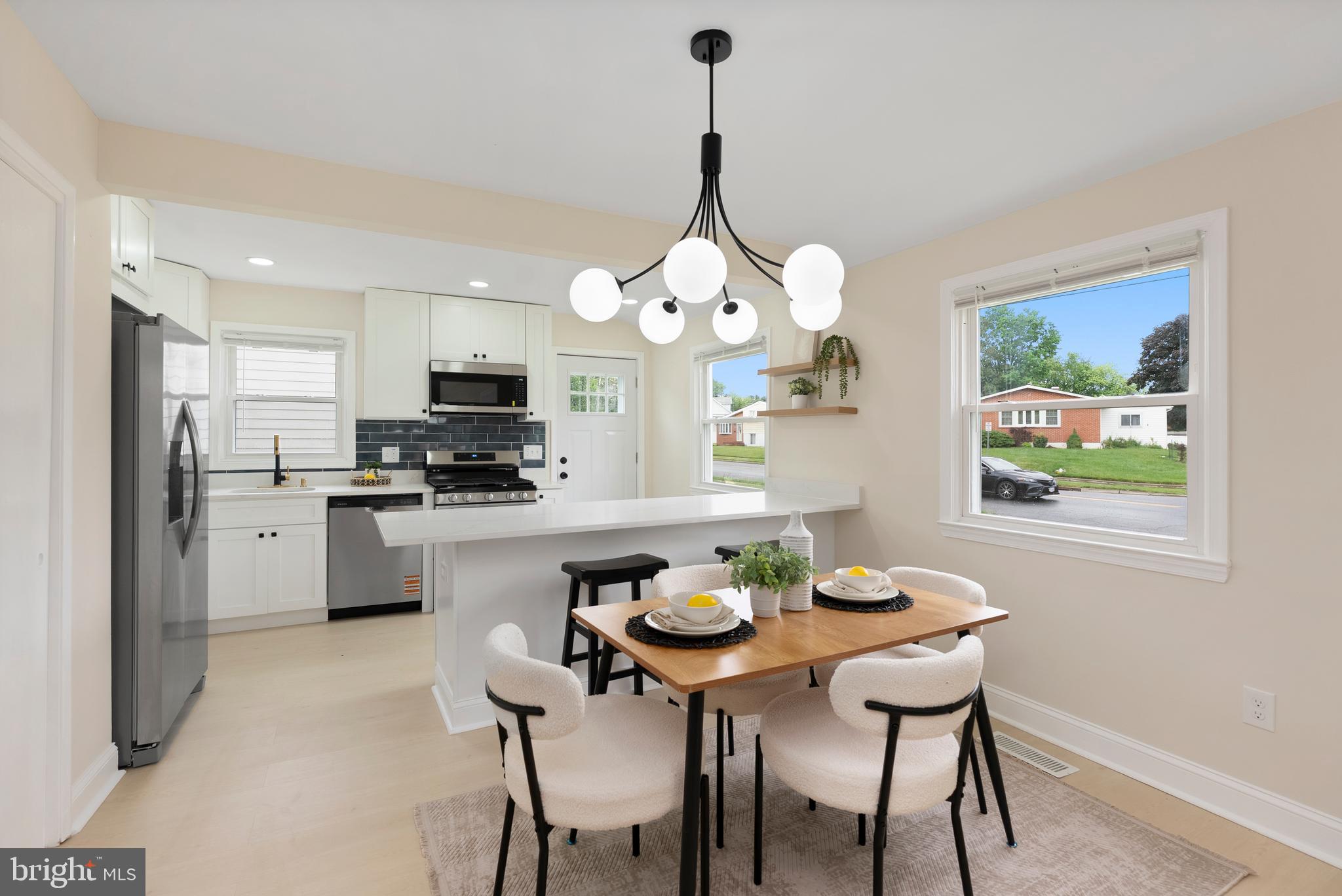 Welcome home to 5011 Old Court rd! This updated home boasts an array of modern finishes, featuring 3 bedrooms and 2 bathrooms. Step inside, and you'll be greeted with the open-concept main living area flooded with natural light and soaring ceilings. The spacious living room offers a sleek fireplace and flows seamlessly into the dining area and kitchen, creating an ideal layout for everyday living and entertaining. The kitchen includes a center island with seating, ample cabinet space, new quartz counters, tile back-splash and stainless steel appliances. Your upper-level features 3 bedrooms and 1 full bathroom with modern high-end finishes. The fully finished lower level offers an additional full bathroom and can be used as a family room, home gym, or extra space for guests - and also has a private separate entry. Conveniently located near and with easy access to 695, 795 and I-70. And let's not forget about the sizable backyard and driveway!