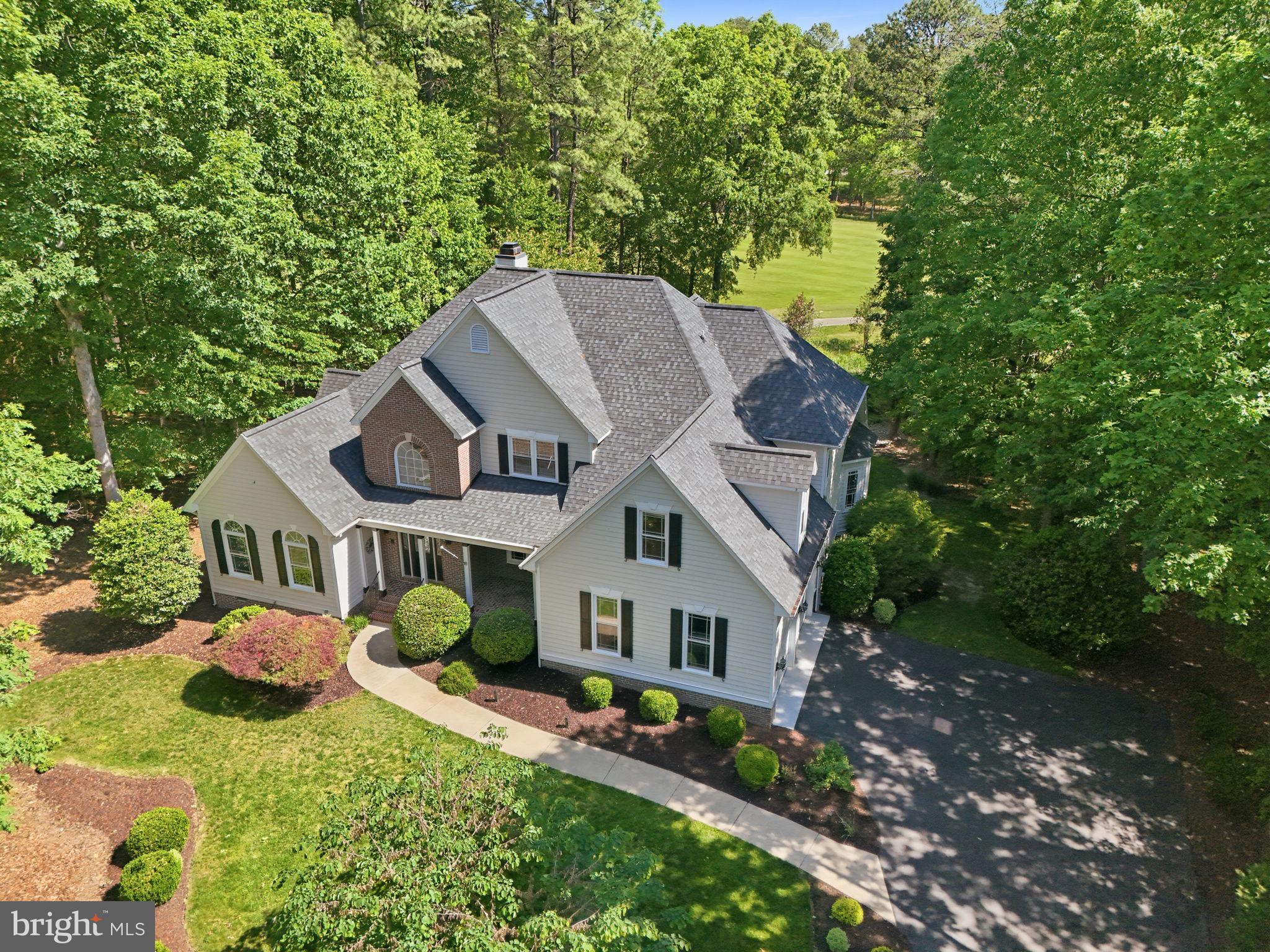 Located within the prestigious gated Fawn Lake Community, this Gorgeous Dream Home showcases a beautifully appointed interior defined by incredible craftsmanship and timeless finishes at every turn. 
Perfectly sited  on a picturesque 1+ acre lot overlooking the famed 17th Fairway of the Fawn Lake Country Club Golf Course! 
This former Sagun Model, crafted with quality craftsmanship by one of Fawn Lake's Signature Builders features a well appointed ​semi-open floor plan designed for today's lifestyle. Exquisite moldings, ​vaulted ceilings, hardwood floors, and beautiful architectural details accent the stylish spaces. ​Well maintained, and full of character, this home greets you with a sprawling lawn and a ​charming brick front porch.
Inside, a​ grand two-story ​Foyer is anchored by a Formal Dining Room, and a ​beautiful Family Room with vaulted ceilings and Palladium windows. The ​stunning Great Room with gas Fireplace​ flanked by custom bookcases, tall windows and ​soaring ceiling ​is flooded with natural light and offers incredible vistas. 

The Gourmet Chef's Kitchen boasts beautiful cream cabinetry, two islands, granite countertops, stainless steel appliances, built-in desk area, and a Butler's  Pantry. The light-filled breakfast area featuring walls of windows is the ideal setting for enjoying meals and taking in breathtaking  views.  
French Doors grant access to an amazing  Screened Porch and Deck, for abundant seamless outdoor living, dining, entertaining, and relaxing, surrounded by nature.

​A true sanctuary, the main level Owner​s Suite​, complete with a Sitting Room and gas Fireplace​, features a ​fabulous remodeled luxury Spa Bath with a large soaking tub, ​Marble tile shower​, dual vanities ​and Marble floors. Two large walk-in closets offer ample wardrobe storage. 

A back staircase leads to the upper level, which features Four spacious Bedrooms with large walk-in closets and Two full Baths.

The spacious Laundry/Mud Room, complete with utility sink​ and cabinets​, offers plenty of additional storage and organization. 
The huge unfinished Basement offers plenty of flex space for future expansion endless possibilities to suit your needs! 

An​ inviting screened Porch with a wood tongue and groove ceiling offers plenty of space for outdoor living and entertaining while overlooking the scenic fairway.
​
The beautiful​ backyard surrounded by large trees, and an array of flowering shrubs offer a canopy of shade and privacy, yet incredible views of the golf course.​ The grounds are easily maintained by the in-ground Irrigation system!

​An Oversized ​2-Car Garage and extended​ driveway​ offer ample parking.

Located in ​a very desirable, quiet and established area, within walking distance to the beach, tennis courts, Country Club Restaurants, fitness center, and all the wonderful amenities Fawn Lake has to offer!

The beautiful luxury and vibrant Fawn Lake Community offers amazing amenities such as a boating recreational lake, sandy beach, an Arnold Palmer designed Golf Course, pickleball and tennis courts, baseball and soccer fields, dog park, volleyball courts, walking trails, Community ClubHouse, marina, fitness center, restaurants, Country Club, playgrounds, and so much more! Plus with an array of clubs, groups and daily activities, you will have plenty of opportunities to join the social scene, make new friends and remain active!
Located in the countryside near the town of Fredericksburg, surrounded by park lands and only a few miles to the farm market, wineries, and award winning breweries! Conveniently located to shopping, restaurants, top-rated Riverbend District schools and I-95!