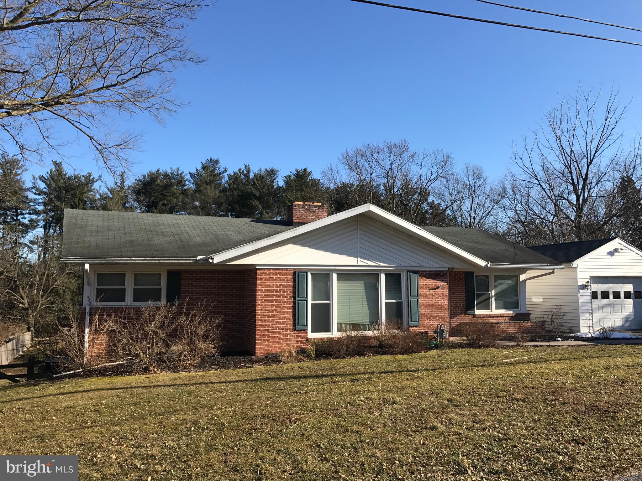 CAN YOU IMAGINE THIS?  A solid brick ranch home on an acre with a creek, a fenced in yard, and adjacent to a golf course!  Oh, yes, and the home has hardwood floors throughout!  Finished walk-out basement! Lovely brick gas fireplaces, on each level!  Large kitchen with extra pantry! Spacious bedrooms!  Plenty of closet and storage space! Potential for 4th bedroom with full windows in basement if needed. Covered patio overlooking back yard.  A great location for entertaining or gardening!  Enjoy the creek, safely outside the fenced area... a great place to sit and relax to the sound of running water!  The property borders the golf course beyond the trees!  The home is only a couple of minutes from grocery store, pizza, gas, etc... location location location!  Many sought after features and at a great price!