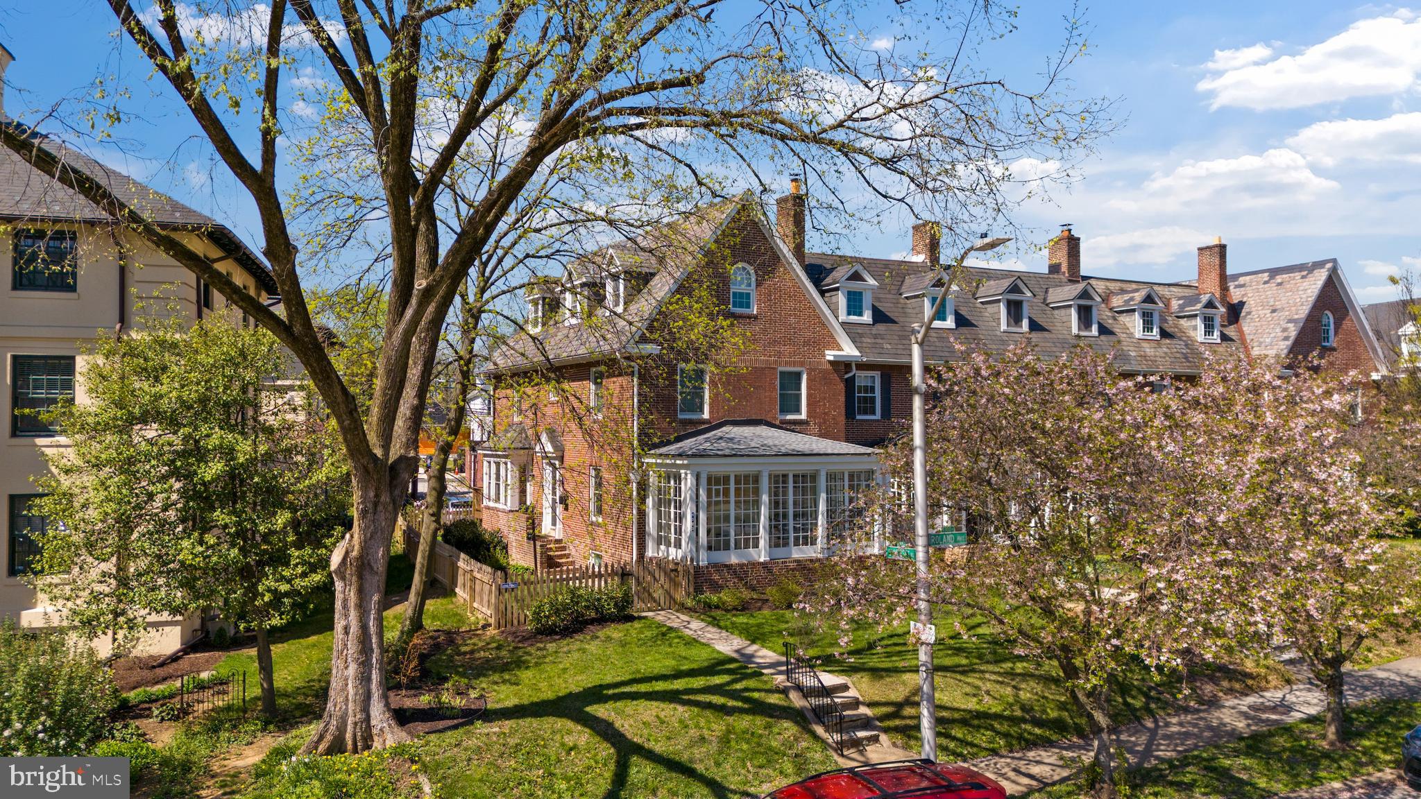 OFFER DEADLINE 5PM SUNDAY MAY 3rd. Welcome to 4302 Roland Ave, a timeless Roland Park end-of-group townhome situated on a double-sized lot with a fully fenced yard and a private two-car parking pad.

This bright end unit features 2,316 square feet of finished living space across three levels, offering five bedrooms and two full baths. The home is filled with natural light from southern, eastern, and western exposures. The main level boasts a spacious living room with 9' ceiling, hardwood floors and a wood-burning fireplace, a sunroom perfect for morning coffee, and a huge renovated open kitchen equipped with a professional-grade Blue Star gas range and a breakfast bar island.

The second level features a large primary suite with stylish exposed brick, alongside two additional bedrooms or offices and a renovated hallway bath with a soaking tub. The third level includes two more bedrooms and a modern Euro-style full bath. For your comfort, the home includes central AC, Anderson replacement windows, and gas-powered steam heat.

The property also offers a large basement for storage with direct walk-out access to a stone patio, a lush lawn, and a new Trex deck (2024). Recent updates include the deck (2024), privacy fencing (2024), central AC, and Anderson & Pella replacement windows and doors.

Walking distance to Rotunda, Hampden, Roland Park gems like Petit Louis, Jonny's in addition to playgrounds and parks. Welcome home!