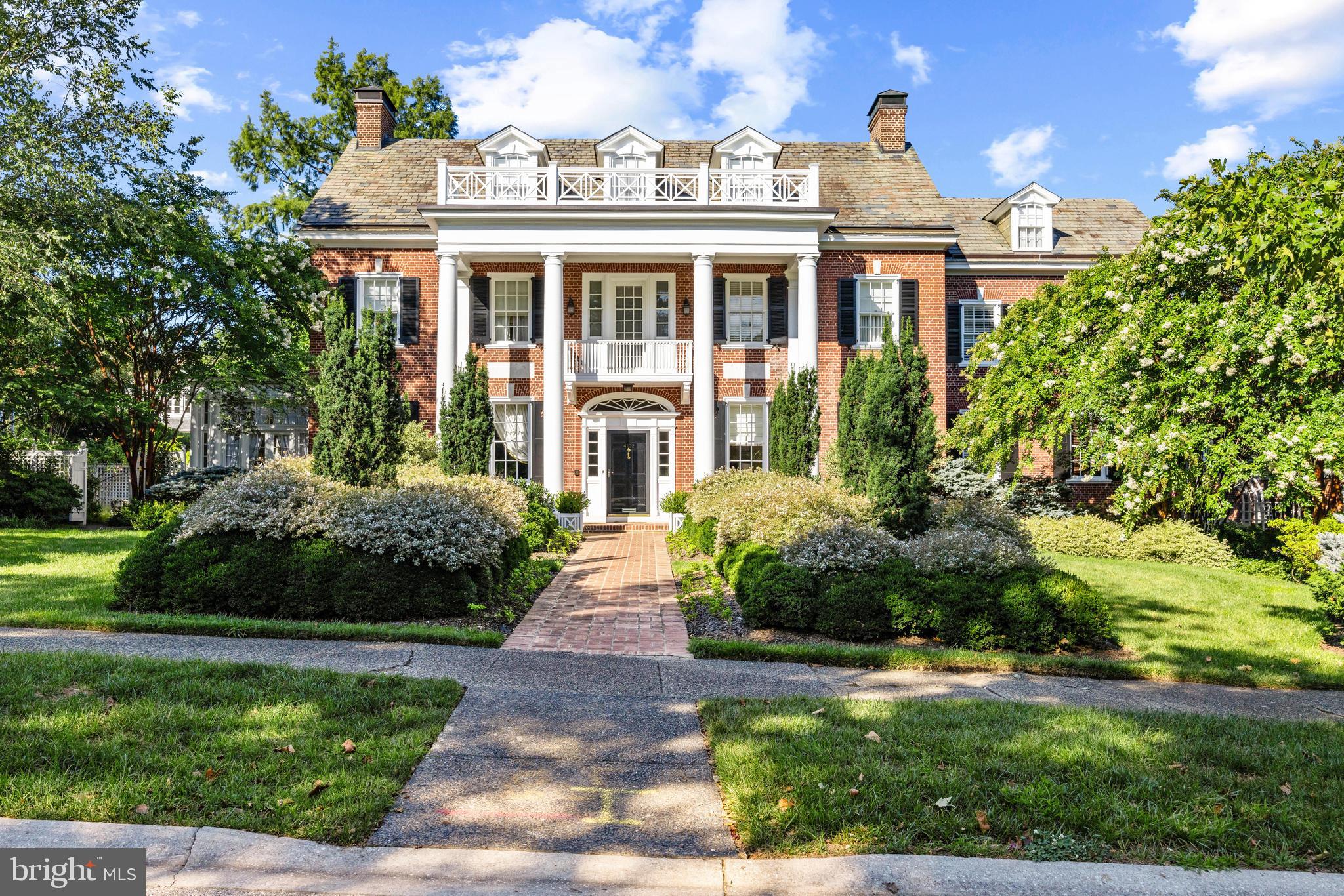 A Timeless Masterpiece in Baltimore’s Prestigious Guilford Neighborhood - Nestled in the heart of Baltimore’s esteemed Guilford neighborhood,  across from the breathtaking Sherwood Gardens, 4102 Greenway presents a rare opportunity to own a distinguished example of early 20th-century architecture. Originally designed in 1916 by renowned Philadelphia architect Louis Harold Rush for his sister and her husband, this stately residence exudes timeless elegance and masterful craftsmanship. In 1925, acclaimed architects Wilson Levering Smith and Howard May expanded and remodeled the home, further elevating its grandeur  Over the past two decades, the current owners have meticulously restored and enhanced the property, cultivating exquisite gardens that transform the landscape into a seasonal spectacle. The front is adorned with vibrant tulips and evergreens, while the rear garden is a sanctuary of blooming roses and lush plantings, offering an enchanting retreat.
An Interior of Unparalleled Elegance - Stepping through the grand entrance, guests are welcomed into a spacious center foyer, setting the tone for the home’s refined interiors. Period lighting fixtures and intricate moldings throughout showcase the unparalleled craftsmanship of the era. Double arched French doors connect the living room to the inviting sunroom, creating a seamless flow of natural light and an airy ambiance. The formal dining room leads into a beautifully appointed butler’s pantry and a chef’s dream kitchen. Custom-built mahogany cabinetry, exquisite Officine Gullo appliances—including two refrigerators, two freezers, an eight-burner gas stove, and double ovens—make this space both functional and luxurious. A large center island provides ample space for culinary creations, while the built-in dining nook offers an intimate gathering spot. A thoughtfully designed rear entryway with built-in closets ensures coats and everyday essentials remain neatly tucked away.

Sophisticated Private Quarters - On the second level, the luxurious primary suite offers a private sanctuary with his-and-hers dressing areas and separate baths. A beautifully adorned guest suite boasts an en-suite bath and an attached sunroom, perfect for relaxation. A charming third bedroom, paneled with hidden cabinetry and closets, is a unique retreat. This level also features a hobby/bonus room and an additional full bath.  The third floor extends the home’s grandeur with two additional bedrooms and two fully renovated bathrooms—one with a shower, the other with a soaking tub. Additional office and den spaces provide the perfect environment for work or leisure.

A Stunning Lower Level for Entertaining - The fully renovated lower level is designed for entertainment and comfort. A second kitchen ensures effortless hosting, while the expansive family room—with a gas-burning fireplace, coffered ceilings, and exposed brick—sets the scene for game nights and movie marathons. Wine connoisseurs will delight in the wine room adjacent to the family space. Additional areas offer flexibility for game tables, exercise equipment, and ample storage.

Exceptional Exterior Features - Practicality meets luxury with a detached two-car garage featuring new automatic doors and a heated driveway, courtyard, and front walkway—eliminating the need for shoveling on snowy days. Above the garage, a renovated studio apartment with a full bath provides a private guest or au pair suite.

A Garden Oasis - The meticulously curated gardens are a true showstopper, bursting with roses and perennials that bloom throughout spring, summer, and fall. Thoughtfully designed hardscaping enhances the outdoor experience, offering tranquil spaces for relaxation and entertaining.

4102 Greenway is a rare gem that seamlessly blends historic elegance with modern luxury, offering an extraordinary living experience in one of Baltimore’s most coveted neighborhoods.