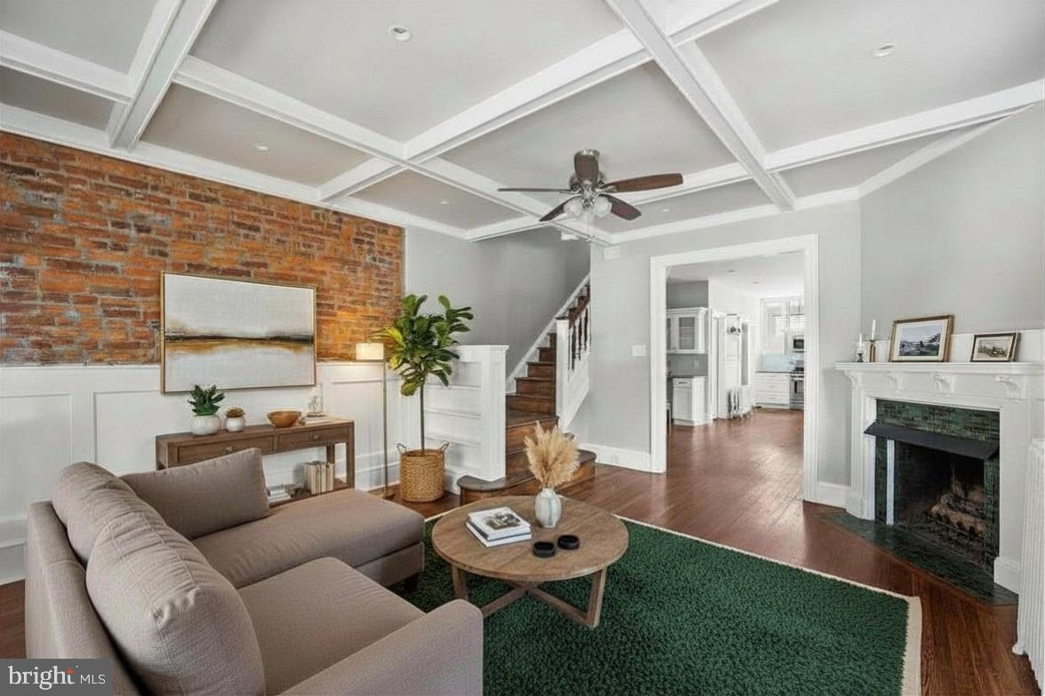 Welcome home to 5930 Pulaski Avenue, a polished twin set on a quiet, tree-lined street known for its wide layout and set-back homes in sought-after West Germantown. Filled with natural light, classic character, and modern upgrades, this 4-bedroom, 2.5-bath residence offers generous living areas, ample storage, and flexible space throughout.

The main level showcases refinished hardwood floors, original moldings, recessed lighting, and thoughtfully preserved details. The open living room features an exposed brick accent wall, built-in staircase bookcase, coffered ceiling detail, and a tiled fireplace. The large dining room offers oversized windows that pour in natural light, along with a built-in dry bar, making it ideal for entertaining. It flows into the updated eat-in kitchen, complete with a walk-in pantry, 42” upgraded white cabinetry, stainless steel appliances, a farmhouse sink, granite countertops, and a modern backsplash. A convenient mudroom/utility area with a powder room in the rear provides access to the fenced backyard.

The second floor is accessible by two staircases and opens to a generous landing and three well-sized bedrooms, including a primary bedroom with bay windows and a custom-built closet wall. A beautifully updated full bathroom features dual sinks and contemporary finishes, while a galley kitchen completes this level.

The third floor provides additional flexible living space with a fourth bedroom, a dedicated office or playroom, a hallway closet, a large walk-in closet with built-ins, and a surprisingly spacious full bathroom.

Ideally located near Clifford Park, the Wissahickon trails, local eateries, and Lincoln Drive, with easy access to Center City and the suburbs. A rare opportunity to own a thoughtfully updated home filled with character in one of Philadelphia’s most timeless neighborhoods. 5930 Pulaski Ave., welcome home.