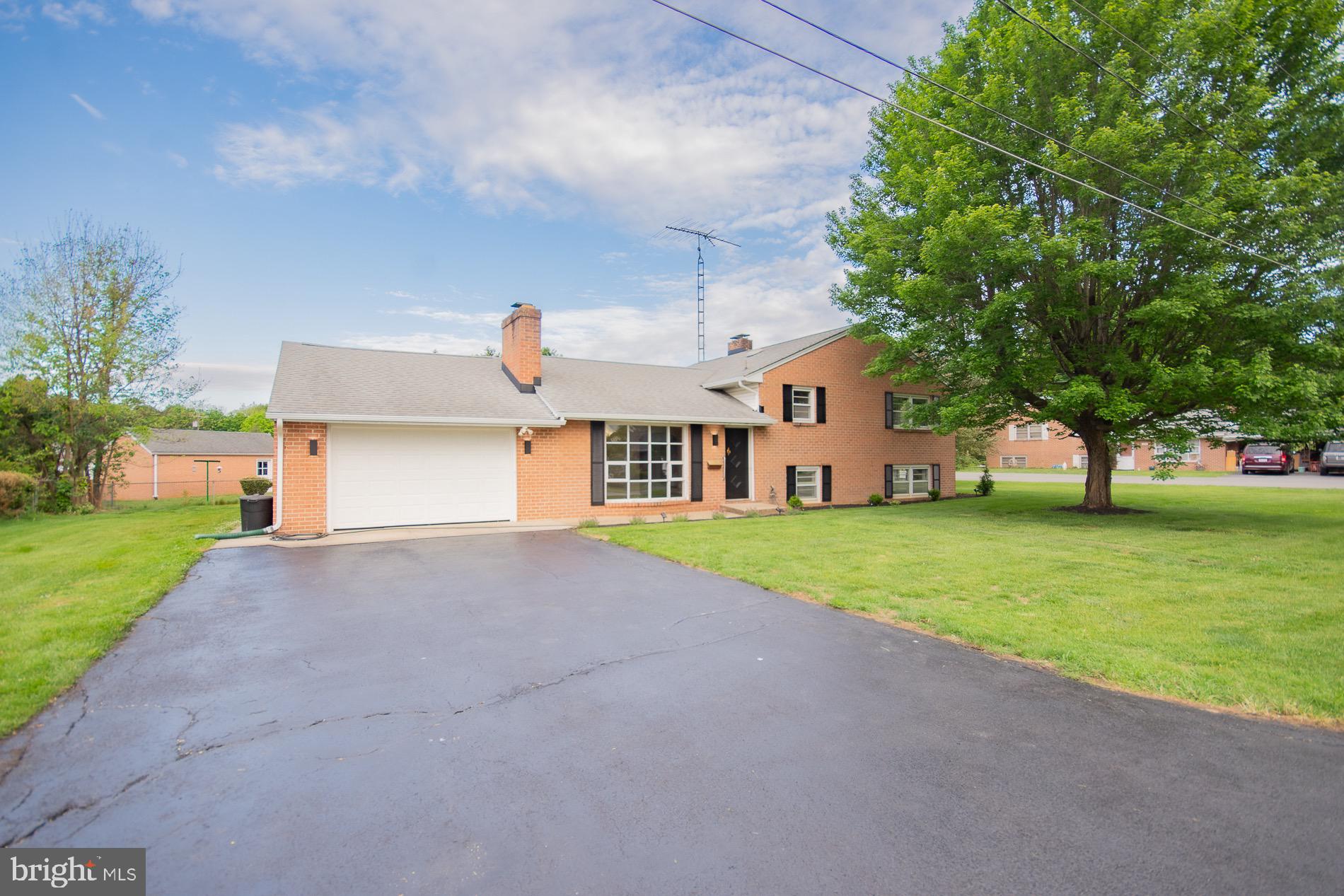 Get ready to fall in love! Available immediately, this wonderfully extra-large tri-level home sits proudly on a corner lot in a highly desirable, well-established neighborhood, and it absolutely shines with charm and comfort.  Featuring 2 brick fireplaces, quartz granite kitchen counters with waterfall edge, and so much more...

With its classic all-brick exterior and a long list of recent upgrades—including a newer roof, new  2 zone HVAC system, fresh paint throughout, updated appliances,  new gutters, new landscaping—this home offers both timeless character and the peace of mind that comes with thoughtful improvements.

Step inside and you’ll be greeted by gleaming hardwood floors and an inviting, spacious layout that feels warm, cheerful, and ready for living. Every room offers generous space and wonderful natural light, making the entire home feel bright, welcoming, and full of life.

One of the most delightful surprises awaits in the beautiful conservatory at the back of the home, where you can enjoy a little everyday luxury. It’s a truly special feature that makes this home feel unique and memorable.

Large, lively, and full of personality, this sweet, sweet home offers comfort, character, and space to spread out—ready for its next owner to move right in and start enjoying from day one.