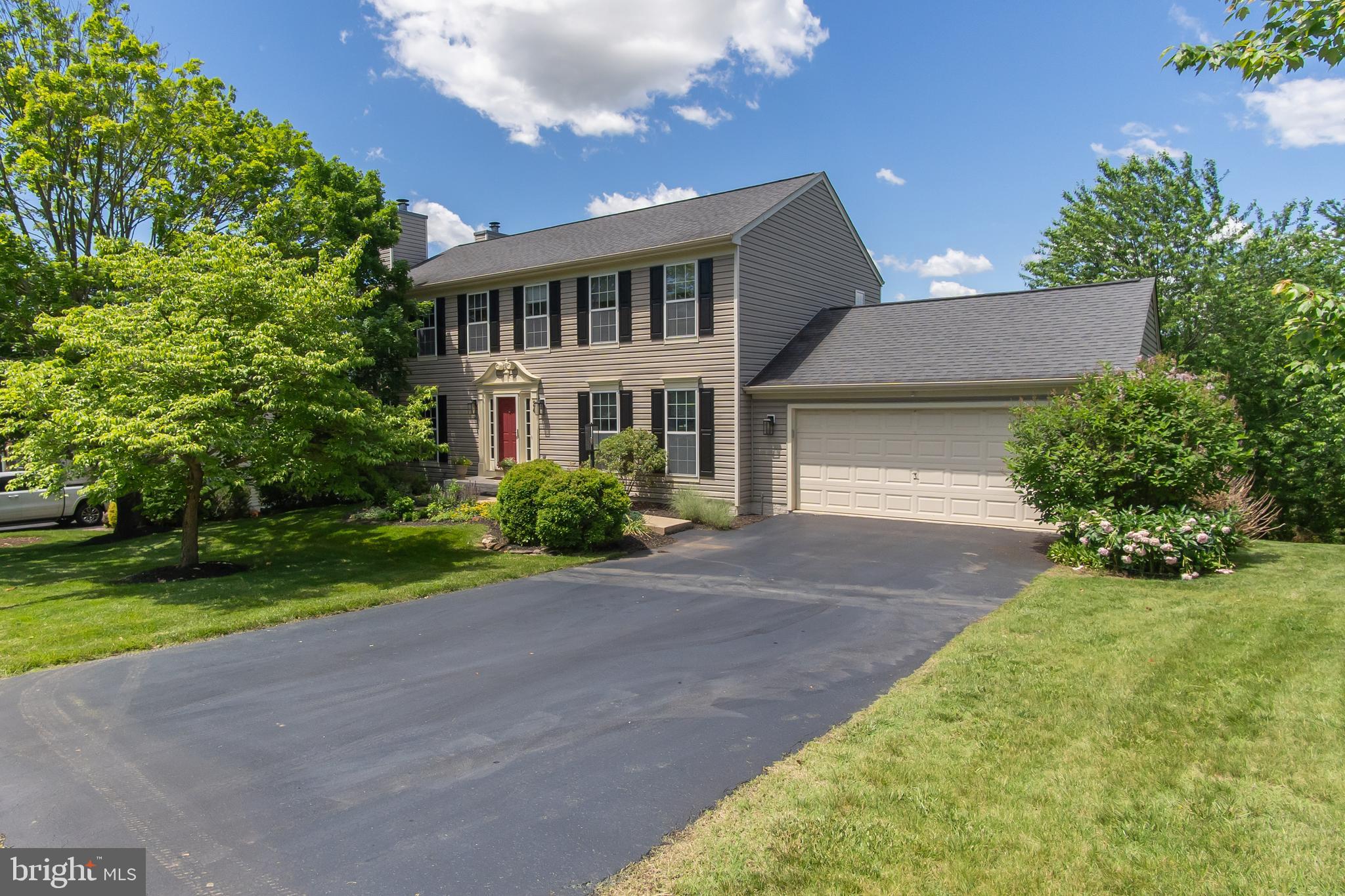 This home offers EVERYTHING you move to Middletown for; small-town feel, walkability to parks, restaurants, library and shopping, top-rated schools, easy access to commuter routes and THE VIEW!  That’s right- one of the few homes in the neighborhood that backs to OPEN SPACE, owned by the town, with a view of South Mountain!  With 3,696 sq ft of living space, you’ll find a welcoming open floor plan with hardwood floors, a sitting room to relax by the gas fireplace open to the family room which includes a second gas fireplace, both with wooden mantles with detailed Cornice molding and stone surrounds.  This room includes a double door to the deck and is open to the eating area, complete with a second double door for maximum deck access.  The kitchen offers 42-inch cabinetry, Corian countertops, an island with pendant lighting and seating for two.  For ease of preparing meals you’ll have the double oven/range and recently renovated pantry with built-in drawers. The formal dining room includes custom boxed trim, chair rail and crown moldings that continue throughout the main level, completed by the full laundry room, powder room and access to the attached 2-car garage.  With 5 true bedrooms upstairs, there is no lack of room for a growing family or guests!  The primary bedroom includes its own en-suite bathroom with soaking tub, separate shower with Subway tile, dual sinks and a large walk-in closet. The 4 secondary bedrooms include lighted ceiling fans and access to the shared full bathroom in the hallway.  The lower level game room with ample seating and entertaining area includes a pool/ping pong table, kitchenette with fridge/freezer combo, microwave and wet bar and a built-in desk with cabinets and access to the covered patio for afternoon shade.  If that weren’t enough, you also get a 6th bedroom with a brand new egress window and huge walk-in closet, 3rd full bathroom and oversized storage room.  The outdoor living space at 24 Young Branch Drive is unmatched with a vinyl, low-maintenance deck with 6 brand new support posts, lighted steps to the paver patio below and a comfortable screened porch where you can enjoy that peaceful view, even on a rainy day.  Recessed lighting, custom window coverings and shutters, built-in shelving, central VAC… even a park that borders the neighborhood!  Water heater (2026), gas fireplace log sets (2026), air purifier system and lower level egress window (2025), roof (2016), NO HOA!  ONE YEAR HOME WARRANTY included!