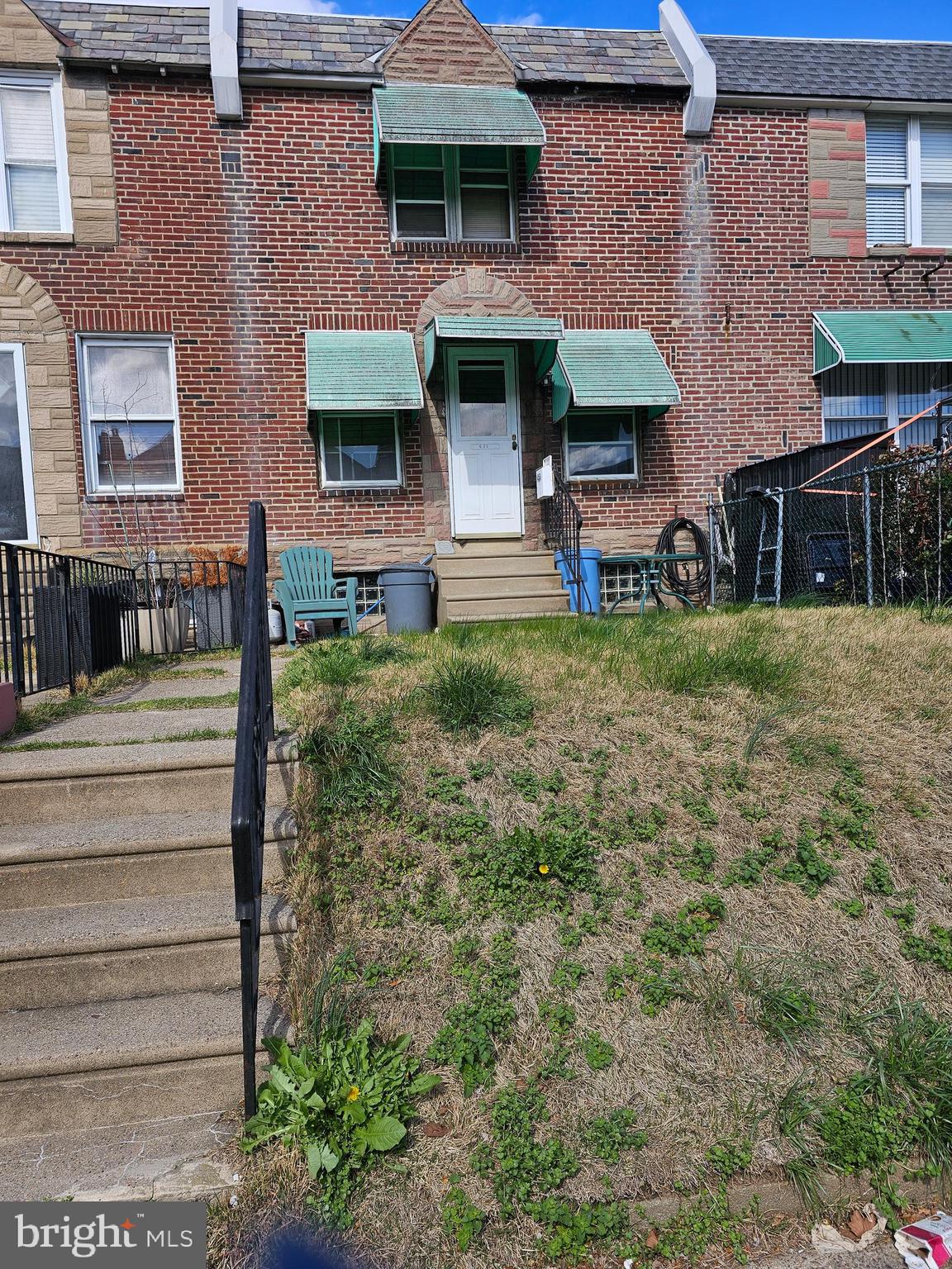 3 bedroom, 1 bath row home with front patio area and rear garage.  Property needs work and is being sold "As IS" seller will not make any repairs, but is willing to clean out contents.