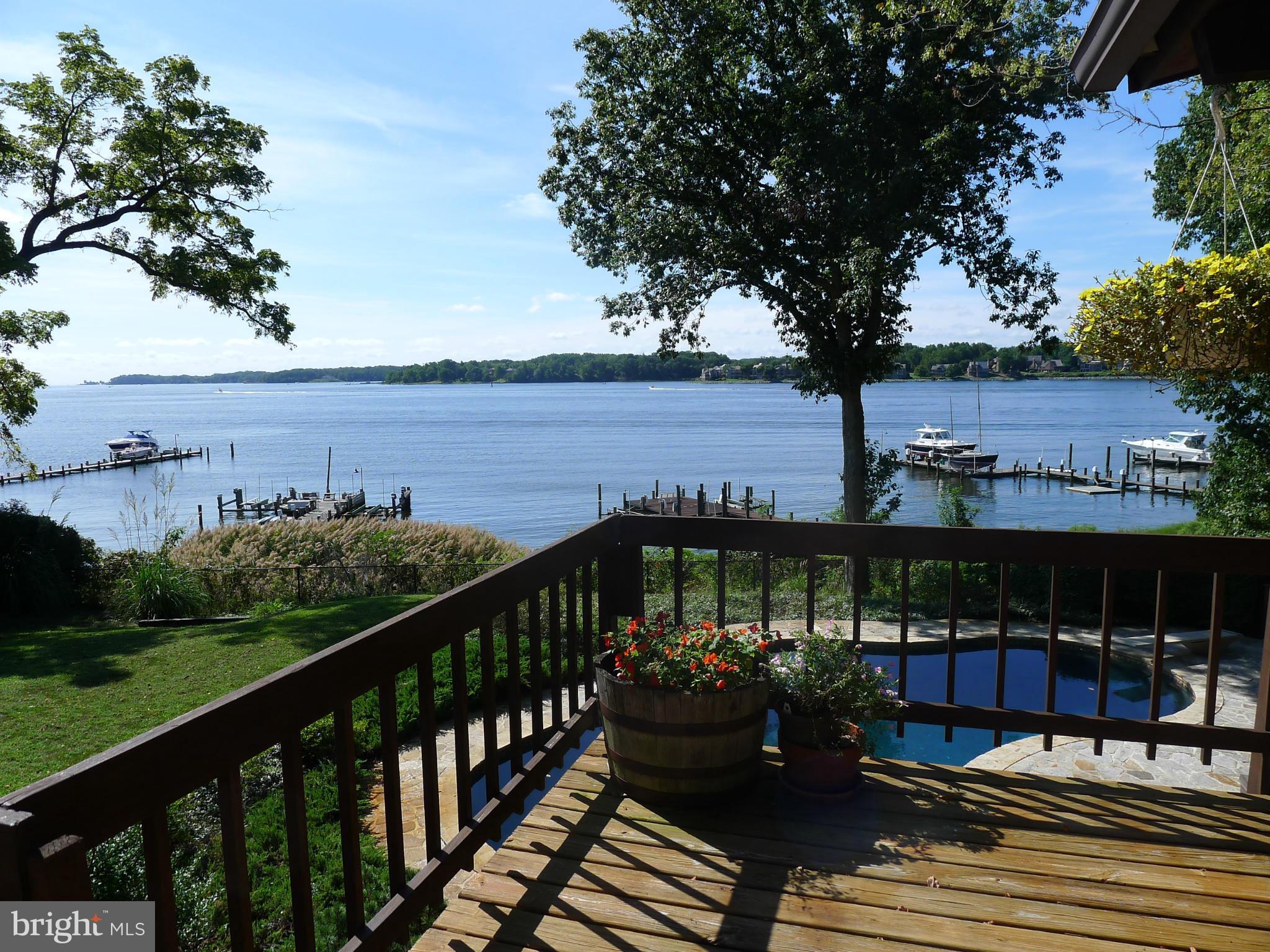 Post & beam Deck House with cedar cathedral ceilings & abundant windows with sweeping views of the South River / Waterside Pebble Tech swimming pool / Gently declining steps to waterfront with sandy beach at low tide / Private pier with 3 lifts / Extended private driveway / Spacious Owners Suite with His & Hers baths, 3 closets & dressing room /Office / Owner financing considered /