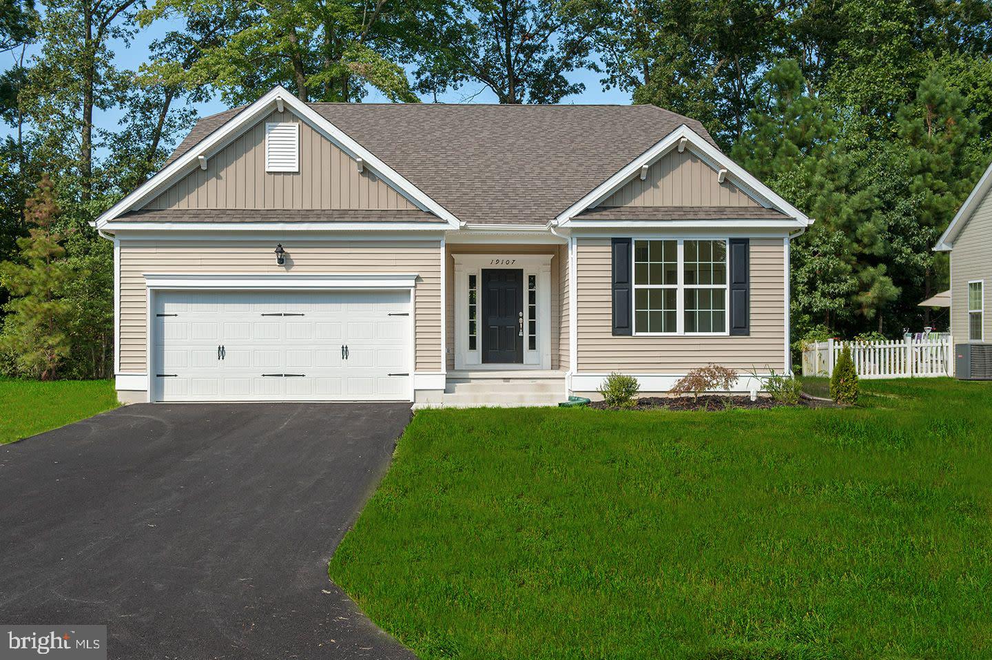 QUICK DELIVERY – NOW UNDER CONSTRUCTION! Welcome to 204 Cog Hill Court in Pinehurst Village, where Ashburn Homes’ popular Windsor model offers the comfort and convenience of single-level living with valuable upgrades already included. This thoughtfully designed ranch features 3 bedrooms, 2 full bathrooms, approximately 1,727 square feet, and an open layout ideal for everyday living and entertaining. The spacious family room is enhanced by a dramatic cathedral ceiling and flows naturally into the kitchen and dining area. The kitchen will showcase upgraded cabinetry, granite countertops, a generous island with 12-inch overhang, tile backsplash, and a stainless-steel GE appliance package—including the refrigerator. Luxury vinyl plank flooring will extend through the foyer, bedroom hallways, and family room. The private owner’s suite features a tiled shower with clear glass doors, while two additional bedrooms provide flexibility for guests, a home office, or hobbies. An 8-foot unfinished basement with an egress window and rough-in plumbing for a future full bathroom creates excellent potential for additional living space. Located in Pinehurst Village with public water and sewer, this home combines new construction, desirable upgrades, and the opportunity to move in sooner without starting the building process from scratch. Schedule your tour today!