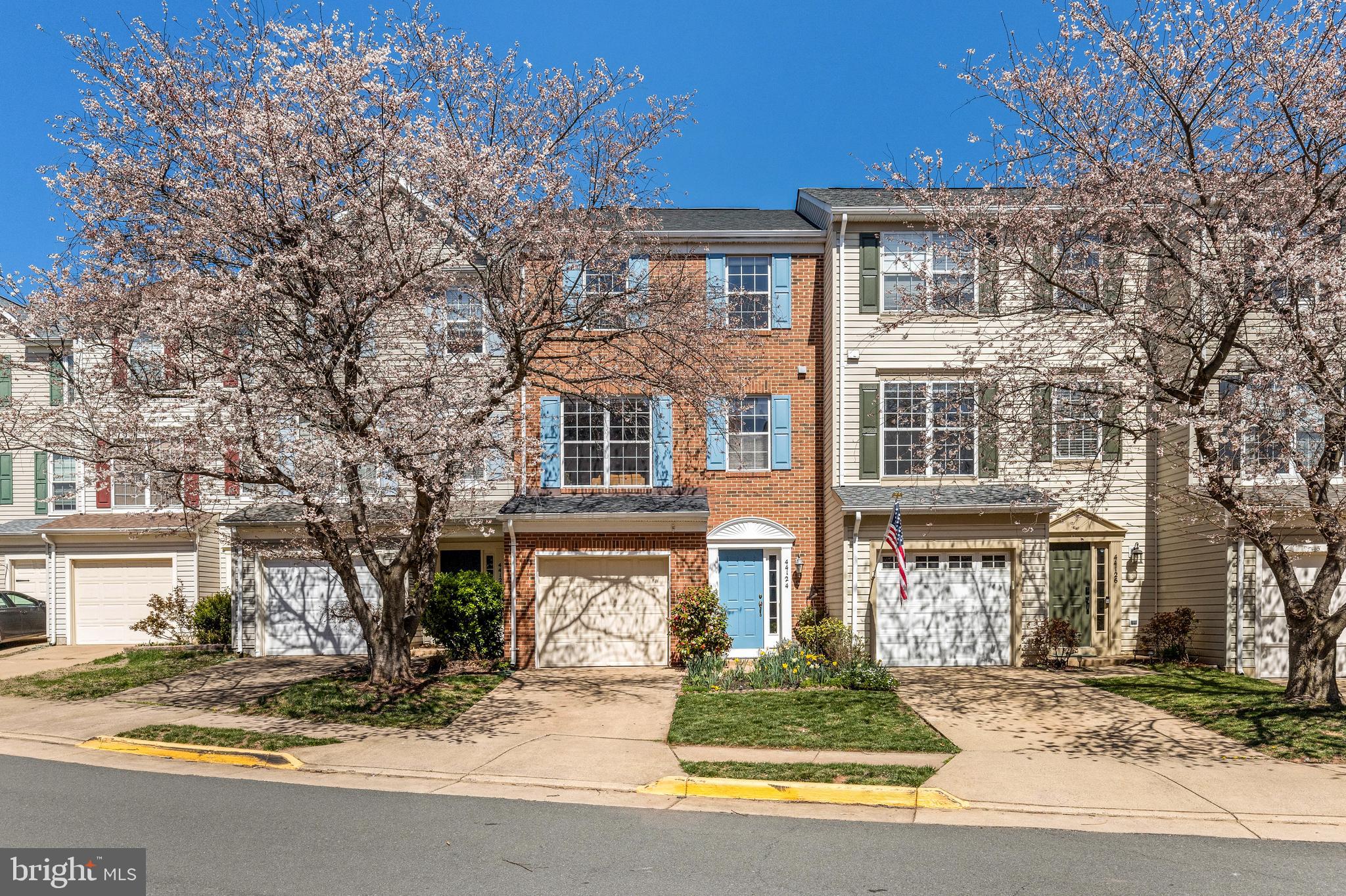 Welcome to 44124 Paget Terrace – a beautifully appointed, brick-front townhouse centered in one of the area’s most coveted neighborhoods, Ashburn Village. This townhome cluster hugs the banks of Pavilion Lake just opposite side of the Ashburn Village Sports Pavilion. It’s an ideal location for anyone who enjoys nature and the opportunity to take full advantage of the community’s fantastic amenities from right outside their door. While conveniently located near shopping centers and major thoroughfares, the home itself offers a peaceful retreat, tucked between a gorgeous Japanese cherry tree out front and the private perennial garden out back. That tranquility carries through the interior of the home with an abundance of natural light that highlights the warm color tones of the hardwood floors, kitchen cabinetry and coordinating paint colors. All three levels benefit from additional bump-out space afforded to it in this popular Brentwood model. The walk-out lower-level features a large, open rec area with gas-fireplace and access to the under-deck area with swing, garden and backyard. The main-level includes a spacious family room, open kitchen with island, seating area, breakfast nook and access to the large deck - perfect for morning coffees or evening cookouts. The upper-level of the home hosts the primary suite with spacious en-suite bathroom that features a soaking tub and separate shower, as well as a walk-in closet. Two guestrooms and a guest bathroom complete the upper-level. Most of the major systems in the home have been updated recently, ensuring peace of mind for years to come. This is truly a special offering of a community and home with timeless appeal.

Ashburn Village offers access to multiple outdoor pools, playgrounds, playing fields, sport-courts, a sand volleyball court and miles of walking/jogging paths. It also includes access to the sports pavilion which features a year-round indoor pool, fitness center, racquetball courts, indoor basketball court, steam room and sauna.  With these unrivaled amenities that are included in the HOA, along with a fantastic location, it is easy to see why Ashburn Village is such a sought-after community.