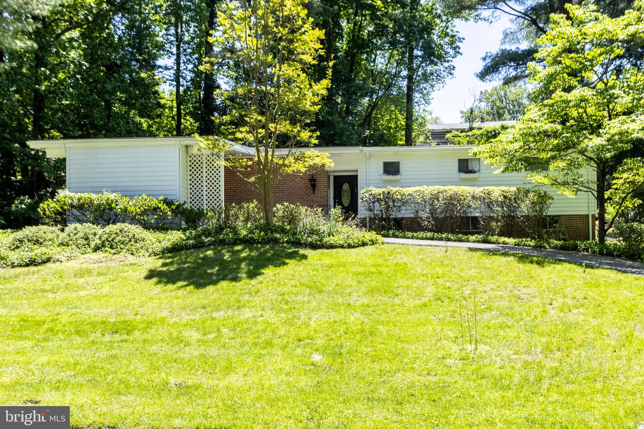 Beautifully renovated split-level home offering an open and airy floor plan designed for comfortable living and effortless entertaining. The bright and spacious living room features a cozy fireplace and sliding doors leading to the rear patio, seamlessly blending indoor and outdoor living. The dining room includes a custom built-in and sliders opening to the screened porch — perfect for relaxing or hosting guests. The sleek modern kosher kitchen is a standout, featuring quartz countertops, a large center island, abundant cabinetry, and sliding doors to the side patio.  A convenient powder room completes the main level. Upstairs, the spacious primary suite offers dual closets and a beautifully renovated en-suite bath with a walk-in shower and private sauna. Two additional generously sized bedrooms and an updated hall bath complete the upper level. The lower level provides exceptional additional living space with a large rec room, fourth bedroom, full bath, cedar closet, and laundry area. This thoughtfully updated home combines style, functionality, and versatile living spaces throughout.