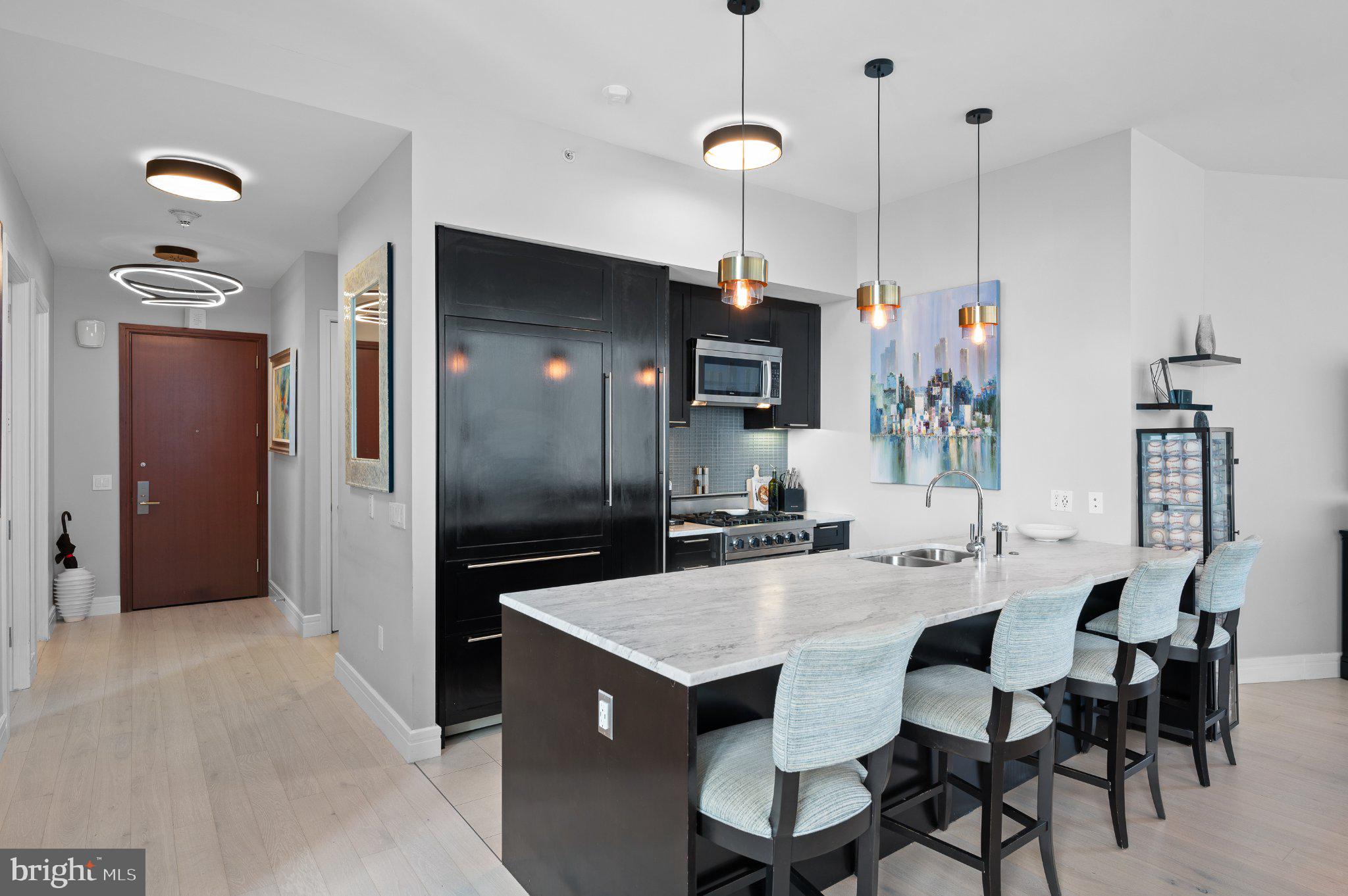 Perched high above Center City in the prestigious The Residences at The Ritz-Carlton, Philadelphia, this exceptional 2 bedroom, 2 bathroom residence offers 1,307 square feet of sophisticated living paired with the unmatched service and luxury lifestyle synonymous with Ritz Carlton. Framed by dramatic floor to ceiling windows and soaring 10 foot ceilings, the home is flooded with natural light while showcasing stunning city views from one of Philadelphia’s most iconic residential addresses.

Designed by world renowned Handel Architects, this contemporary residence delivers elevated design, refined finishes, and effortless luxury at every turn. Rich wood flooring flows throughout, while operable windows in every room create a bright and airy atmosphere. The kitchen has been thoughtfully updated with new marble countertops and features a built in Sub Zero refrigerator and freezer, Viking gas range, built in under counter wine fridge, upgraded double sinks, and Miele Inspira Series dishwasher seamlessly integrated to match the custom cabinetry. Custom storage is seamlessly integrated throughout with custom closets in both the primary and secondary bedrooms, including a dedicated shoe closet. The residence also features newly installed Hunter Douglas full length remote controlled blinds that add both sophistication and convenience throughout the home along with a new Samsung washer and dryer.

Residents enjoy unparalleled white glove service and access to an extraordinary collection of hotel inspired amenities including dedicated concierge services, valet garage parking, chauffeur service vehicles, state of the art fitness center with lap pool and yoga room, residents lounge, media room, outdoor terrace, and a gated landscaped park complete with a 12 foot waterfall. The pet friendly building also features an on site dog run for added convenience. Valet garage parking offers the ultimate convenience for city living.

Luxury extends far beyond the residence itself with access to Ritz Carlton hotel services including in residence dining, housekeeping, and additional personalized offerings available to residents. A seamless lock and leave lifestyle awaits in the heart of the city.

Perfectly positioned on South Penn Square, you are moments from Philadelphia’s finest restaurants, shopping, wellness destinations, and cultural landmarks including Parc, Vetri Cucina, The Love, Boyds Philadelphia, Equinox Center City, Rittenhouse Square, Kimmel Center for the Performing Arts, and The Union League of Philadelphia.

An extraordinary opportunity to experience elevated city living with impeccable service, timeless design, and every convenience at your fingertips. Parking license available to purchase separately or include in price at $849k.