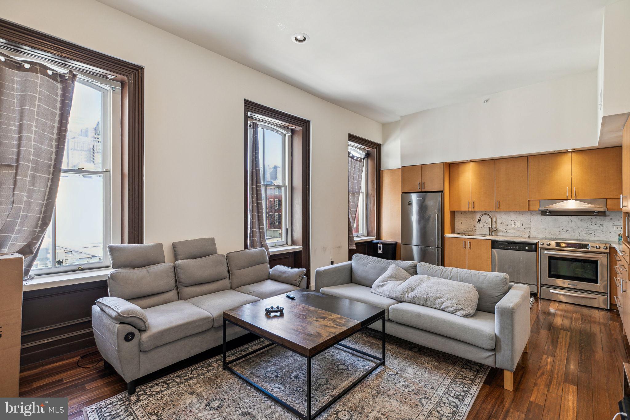Grand and completely custom 2 bedroom, 2 bathroom walk-up in a boutique building less than one block from Rittenhouse Square! The home features high ceilings and hardwood floors throughout, with a sun-soaked living/dining area providing ample space for entertaining. There is an open kitchen featuring stainless steel appliances, wood cabinetry, and marble countertops/backsplash. The luxurious primary bedroom has plenty of natural light, a closet with a washer/dryer, and an ensuite bathroom. Both bathrooms feature wood vanities with glass bowl sinks and modern tilework. Rittenhouse Square is ranked the 6th best neighborhood in North America with 175 restaurants and 199 retailers within a three block radius. The Market Street office corridor, Avenue of the Arts and University City are within walking distance. 30th Street Station and Philadelphia International airport are just minutes away.