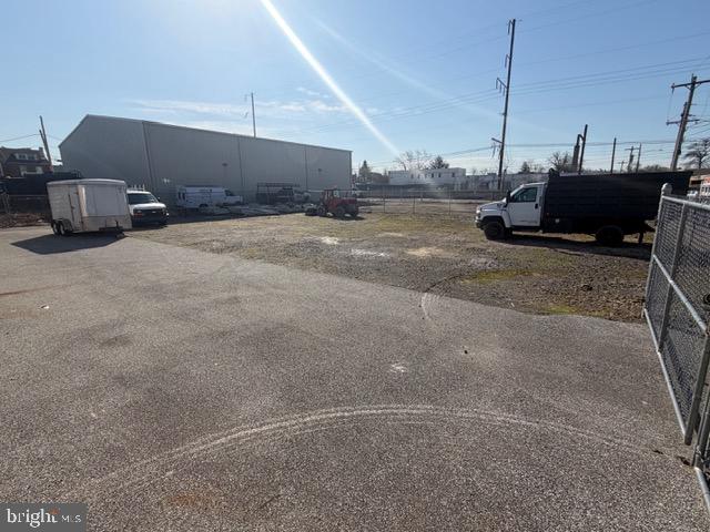 12,000 SF industrial flex space with 16,000 SF fenced in gravel lot. Building features 16' ceilings, 3 garage doors, Phase III power, 3 offices, 3 bathrooms. Offices have heat and air conditioning, warehouse has ceiling mounted gas heaters. Property consists of 5 parcels. This property offers enough space for owner operator and tenants.