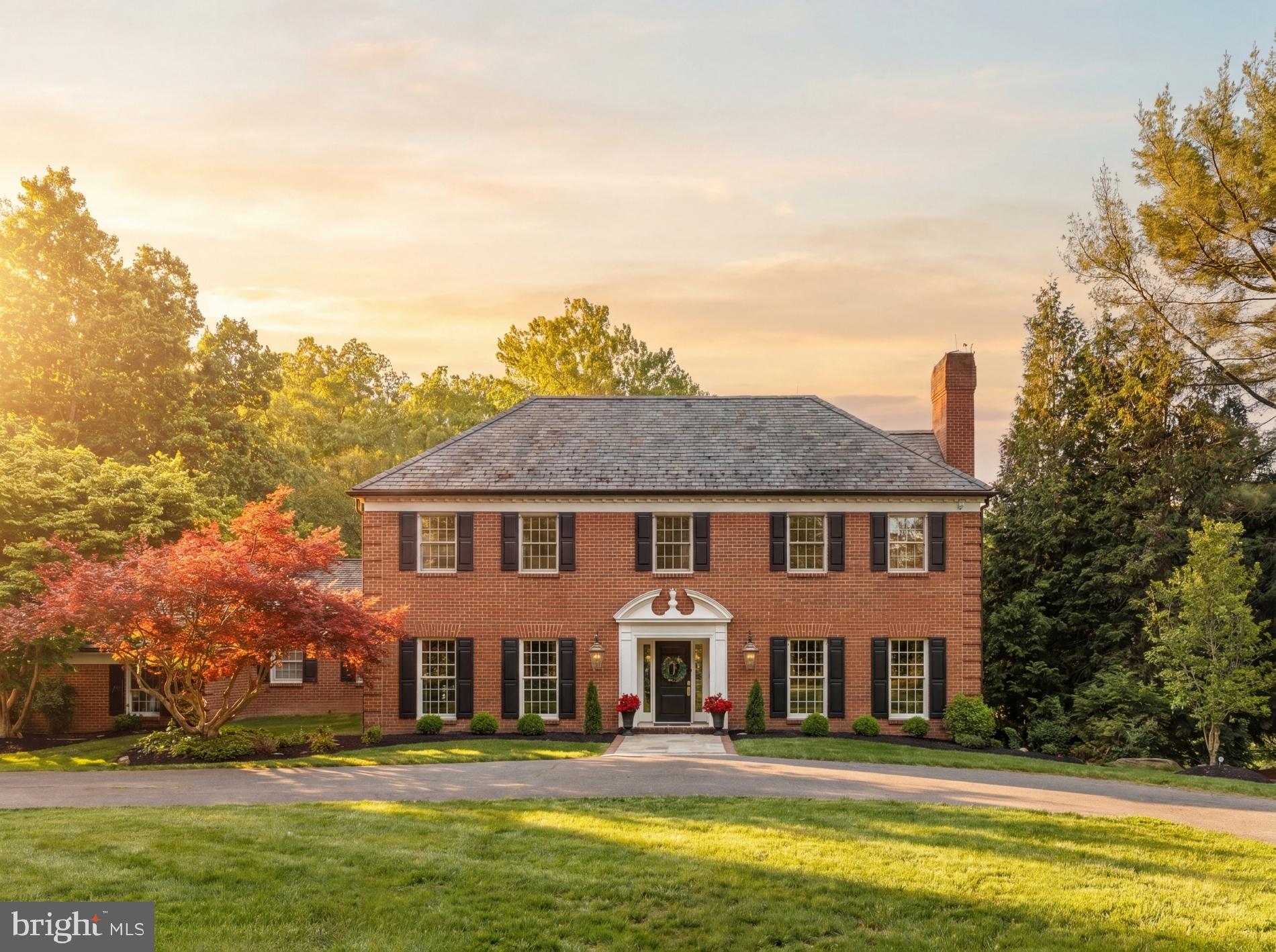 Quietly positioned 1.4 miles from Potomac Village this distinguished Georgian Colonial with sweeping circular driveway and manicured lawn features a traditional floor plan inspiring formal entertaining while offering generous space and functionality to allow for effortless daily living.  
The all-brick facade is classically proportioned and features newly installed windows.  The residence is is nearly 6,000 square feet across three thoughtfully designed levels. The main level welcomes you with beautifully proportioned formal rooms with crown molding and hardwood floors. The gracious kitchen with windows overlooking the treetops and located adjacent to the terrace allows for easy outdoor dining. The expansive family room anchored by the fireplace and built in bookcases offers a casual retreat while the corner sunroom is a location to peacefully take in the view of the acreage, beautiful mature trees and sunshine. 
Newly installed hardwood floors grace the entire upper level, lending a fresh, polished quality to the bedroom wing. The primary suite, situated on the back of the home with views of the trees,  offers a generously sized sleeping room and private office or sitting room plus and expansive walk-in closets provides storage and organization befitting a residence of this caliber. Three additional well-proportioned bedrooms— with jack and jill or en suite baths— complete the upper level. The fully finished walkout lower level expands the home's living footprint considerably, offering a spacious recreation room ideal for entertaining or relaxed family gatherings plus guest bedroom with en suite bath. Direct access to the rear grounds ensures a seamless connection between indoor and outdoor living.