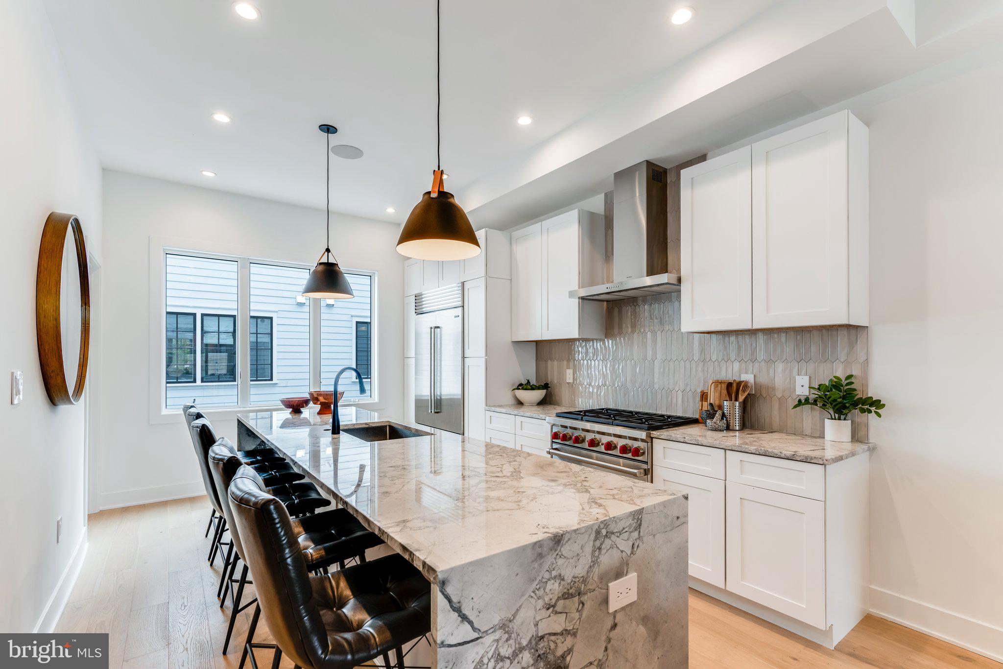 2- CAR PARKING IS OFFERED & NEW FINISHES AVAILABLE! Luxury Living at Lydian Place offers the quintessential city lifestyle. These ten exquisitely designed townhomes on the Avenue of the Arts create a unique urban experience to enjoy the rich cultural life of Center City Philadelphia.  With over 4,000 square feet of living space across 5 levels, each home features 4 spacious bedrooms, 4 full baths, and 2 half bathrooms, with a masterfully designed pilothouse, 2 decks, and a personal elevator! Step up from the light-filled foyer and atrium to the expansive open concept main level. Enjoy the comfortable living room with high ceilings, modern flooring throughout, and an ample dining area that flows into the gourmet chef kitchen. Luxurious yet functional, the kitchen features custom quartz countertops, and backsplash, with appliances from Subzero, Thermador, Bosch, and Wolf. The third floor is comprised of two large bedrooms with en-suite bathrooms, walk-in closets, and a full-sized laundry room. The impressive owner's bedroom is a regal 600 sq. ft and is the ultimate sanctuary occupying the entire fourth floor. The primary bathroom features a freestanding soaking tub, an oversized shower room of seamless glass, a private lavatory, and double vanity. Special attention has been given to the rooftop with a masterfully designed layout highlighting a spacious 375 sq. ft pilothouse complete with a custom wet bar and convenient powder room nestled between the two separate decks. This optimal space for entertaining offers spectacular panoramic views of the Philadelphia skyline. More home enjoyment comes with the fully finished lower-level family room or media room and includes a bedroom/office/exercise room and full bathroom. Each home offers garage parking with tons of extra room for storage, a top-of-the-line security system with one year of free monitoring services, and a multi-zoned energy-efficient HVAC system. The audio system includes five pairs of in-ceiling speakers, one pair of outdoor speakers.  Smart wiring infrastructure is installed for ultimate convenience and future upgrade possibilities with dual data (Cat6) and cable in every bedroom. Walk Score - 97 Transit Score - 100 Bike Score - 88. Conveniently located near Target, Sprouts Market, Whole Foods, Pet Smart, & PA Wine & Spirit Shop. Some homes are currently being built. Taxes estimated, 10 YEAR TAX ABATEMENT, some finish choices may vary, some features shown may vary slightly, Specifications, details, and finishes are subject to change.