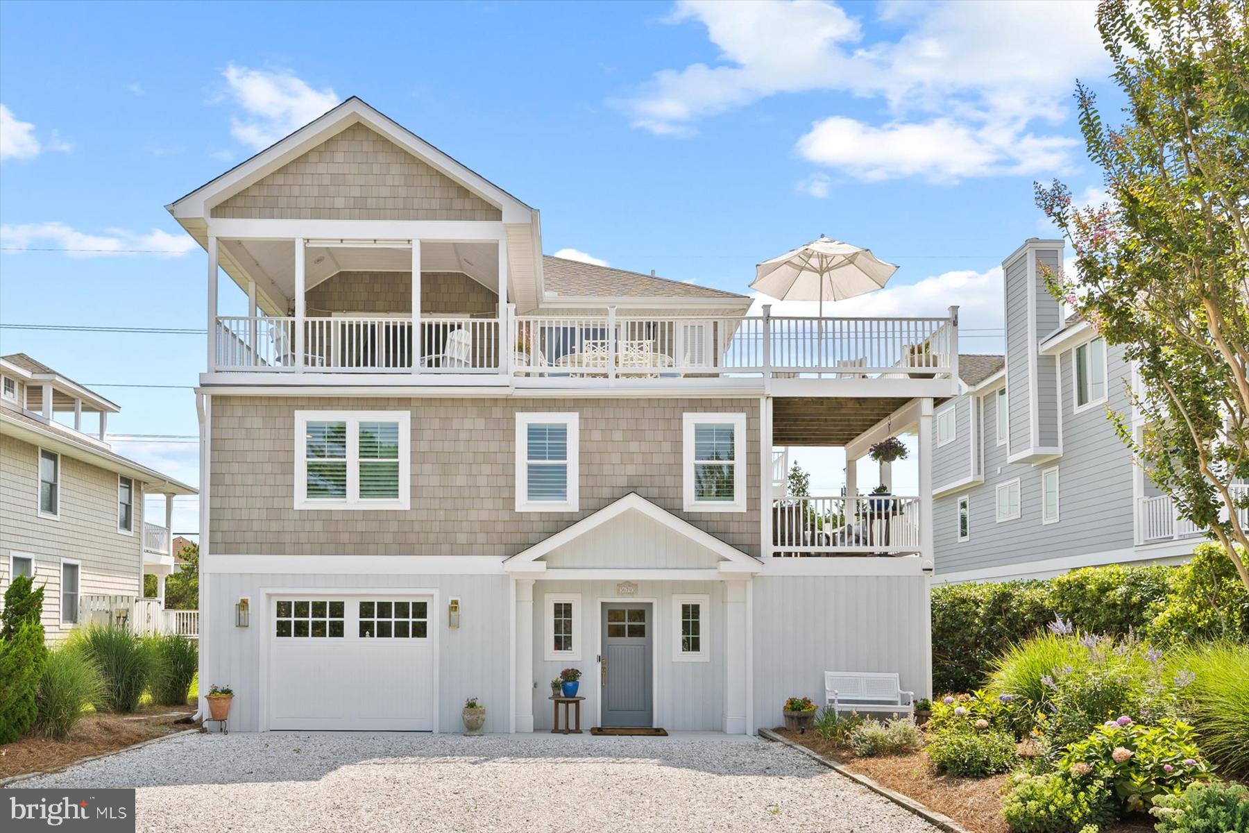 Start your mornings watching the sunrise over the Atlantic and end your evenings with spectacular sunsets over the bay—all from the comfort of your new home. Uniquely positioned between the Atlantic Ocean and the Little Assawoman Bay, this stunning coastal residence has been extensively renovated to offer the ideal blend of timeless design, modern luxury, and breathtaking views. The home’s inverted floor plan is designed to maximize the views. It features an impressive, full-floor open-concept Great Room perfect for family living and gathering with friends. This grand space boasts soaring ceilings, a custom-designed gourmet kitchen, a living area with a beautiful tiled gas fireplace, a dining area, and large Azek decks that provide exceptional indoor-outdoor living. Substantially updated within the last two years, the house is in pristine, like-new condition. Comprehensive renovations include an all-new kitchen, upgraded bathrooms, a modernized laundry room, wide-plank engineered hardwood floors, ceramic flooring, and new indoor/outdoor trim. Mechanical and structural upgrades feature a new roof, new HVAC, new hot water heater, Trex decking, and an enclosed garage with an automatic door. The front exterior has been newly reconfigured with premium NuCedar shingles and channel rustic siding, new windows, doors, and marine-grade lighting. Additionally, the ground level now offers an expanded floor plan featuring a welcoming foyer entrance and two versatile, multi-purpose rooms. Located just north of Fenwick Island in the desirable community of Seatowne, residents enjoy an easy walk to the uncrowded, dog-friendly beaches of Fenwick Island State Park. Premium Seatowne amenities include a community swimming pool, tennis and pickleball courts, and a private bayfront pier—perfect for launching kayaks or paddleboards and fully embracing the coastal lifestyle. The property is professionally landscaped and includes a custom, enclosed cedar garden with raised beds and a built-in irrigation system, adding a tranquil and unique outdoor retreat. Offered partially furnished by the original owner and never offered as a rental, this exceptional property is move-in ready for immediate enjoyment.