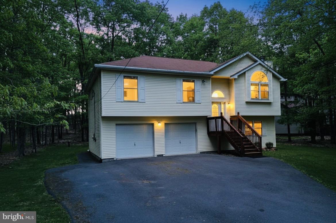 CHARMING SPLIT‑LEVEL HOME with CENTRAL A/C and CENTRAL HEAT, built in 2008, offering STRONG VALUE‑ADD POTENTIAL, negotiable FURNITURE, and located in a highly desirable AIRBnB‑friendly community.
Set on a serene, WOODED LOT, this BRIGHT and airy home offers comfortable MOVE-IN-READY living with exceptional EXPANSION POSSIBILITIES.
The main level features three well‑sized bedrooms and two full baths, creating an efficient layout for everyday living.
The EXPANSIVE unfinished lower level is a standout OPPORTUNITY—already framed with   ADDITIONAL ROOMS and rough‑in plumbing for a THIRD FULL BATH. Finish the space to CREATE a 4-5‑BEDROOM home, an IN-LAW SUITE, or a LARGE RECREATION/BONUS AREA, unlocking IMMEDIATE EQUITY and long‑term flexibility.
Enjoy OUTDOOR LIVING on the DECK with a concrete PATIO and the PRIVACY of a SPACIOUS, tree‑lined 0.69‑ACRE  lot. 
A TWO-CAR GARAGE and WIDE PAVED DRIVEWAY provide ample parking and storage.

Located in an STR‑friendly gated community with low ANNUAL DUES under $1,500, residents enjoy access to FIVE LAKES offering non‑motorized activities such as FISHING, KAYAKING, and CANOEING. Additional AMENITIES include 2 outdoor SWIMMING POOLS, a KIDDIE POOL, 4 TENNIS COURTS, and 2 BASKETBALL COURTS. The community provides 24‑hour security, road maintenance, and trash removal for added convenience.
Perfectly positioned near I‑80, the PA Turnpike, Pocono Raceway, and multiple ski resorts, this home offers both tranquility and accessibility.
Ideal for investors, STR buyers, or anyone seeking a customizable home with strong upside. Finish the lower level to your taste and maximize the property’s full potential.
Schedule your private showing and explore the possibilities.